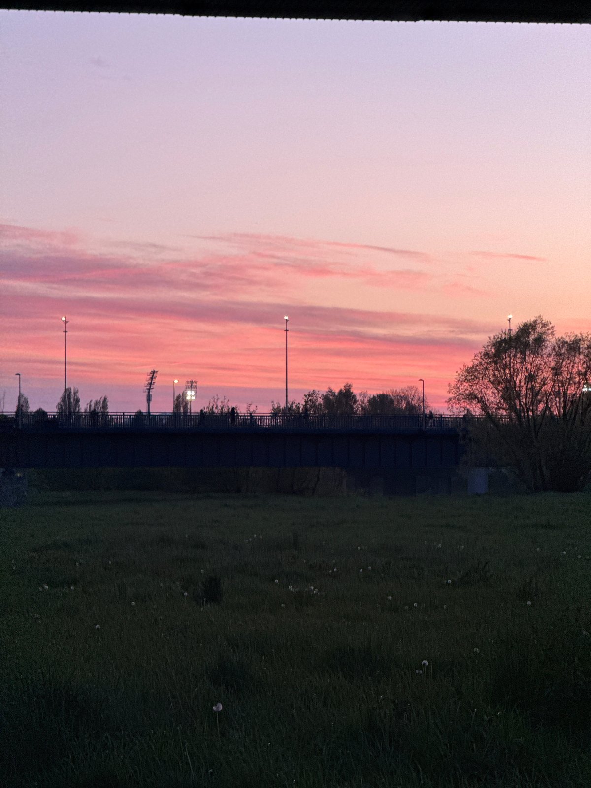 Woman films sunset selfie session by Sava River Zagreb