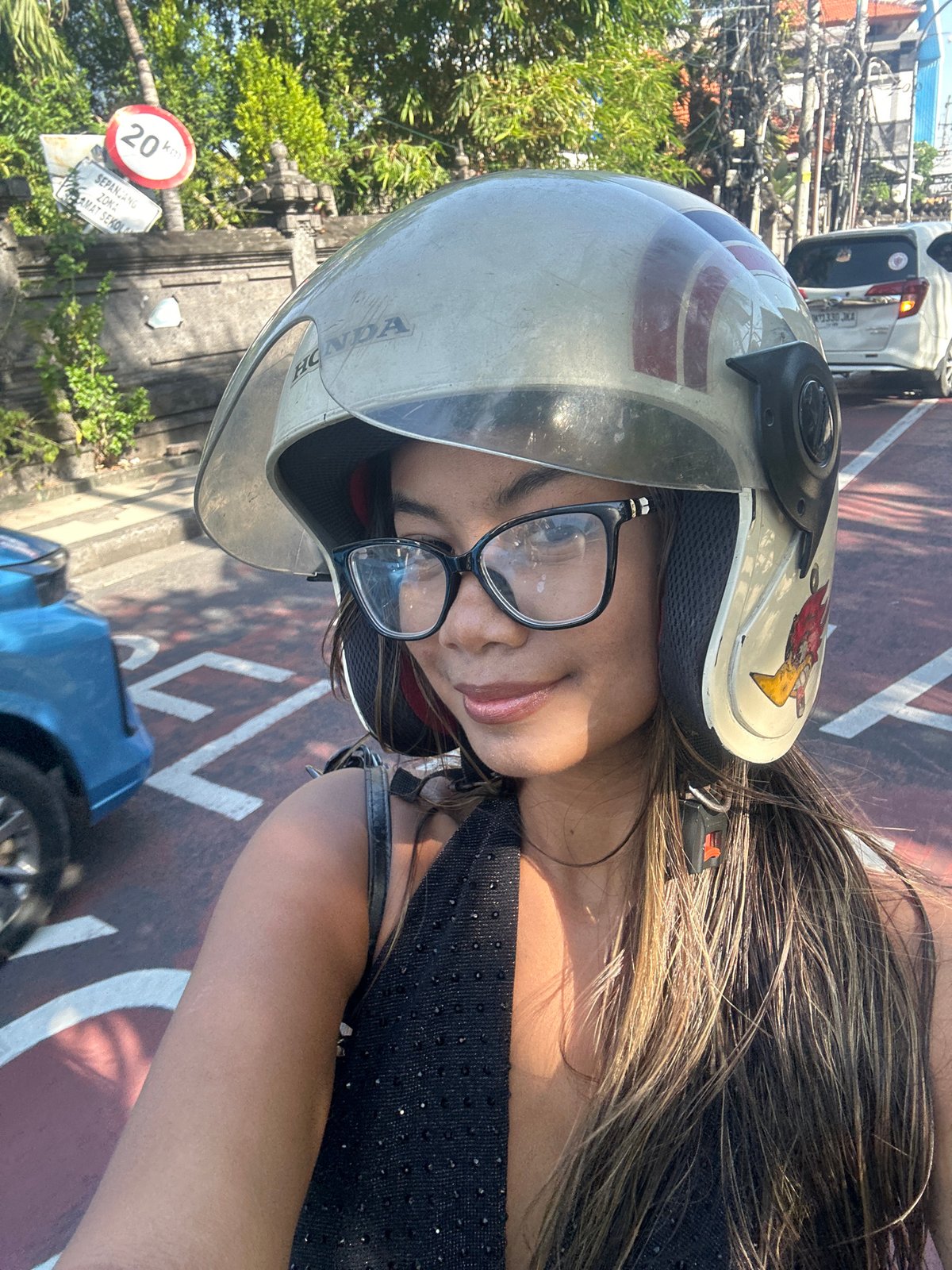 Helmet selfies on a scooter through Kuta, Bali
