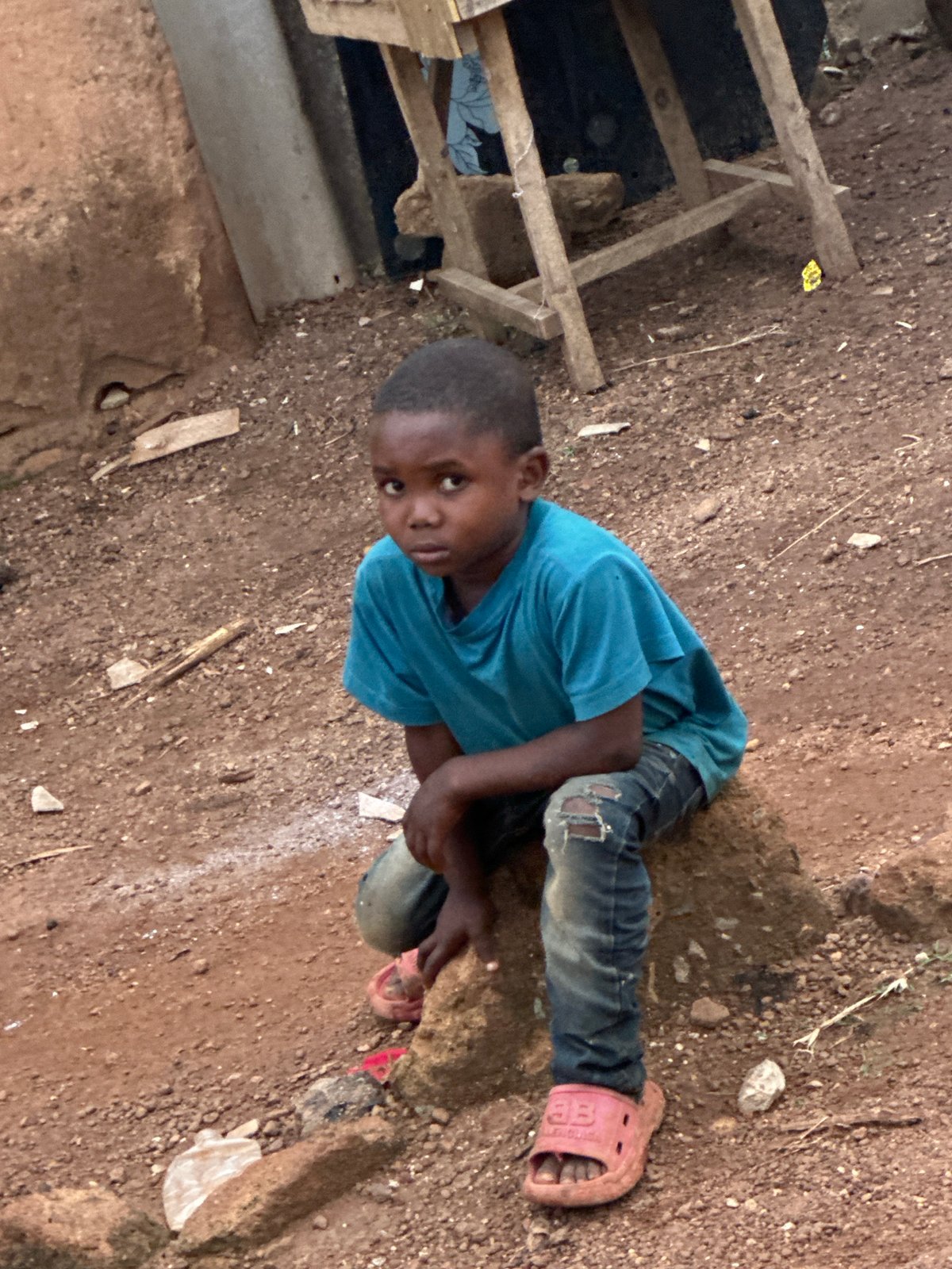 Kids hanging out on rocky ground in Gura Top, Nigeria