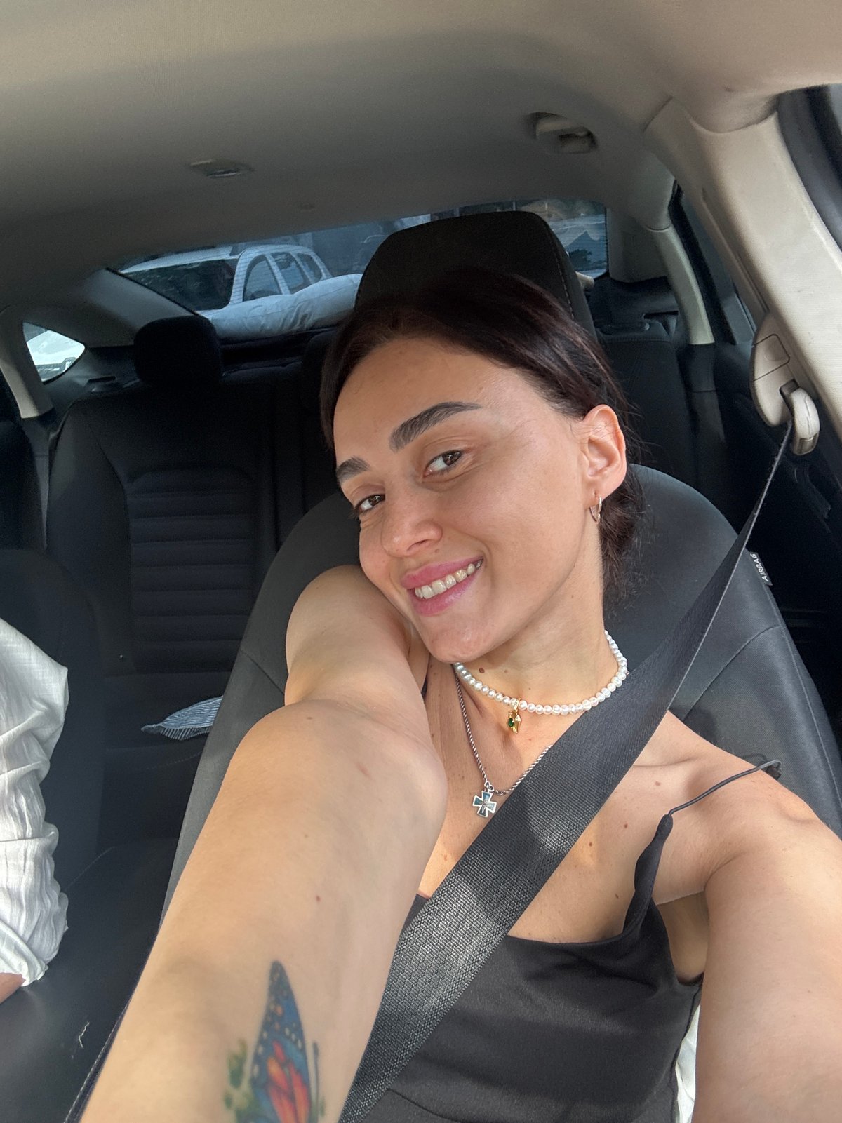 Woman Takes Selfies During Early Morning Car Journey in Tbilisi