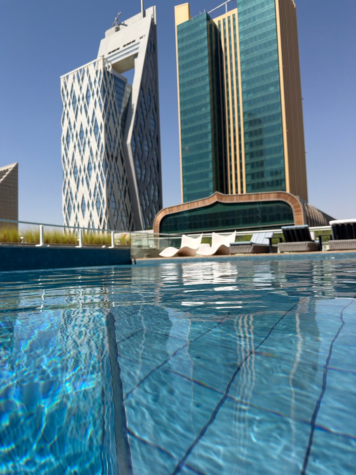 Urban waterfront cityscape with pools and modern architecture documented
