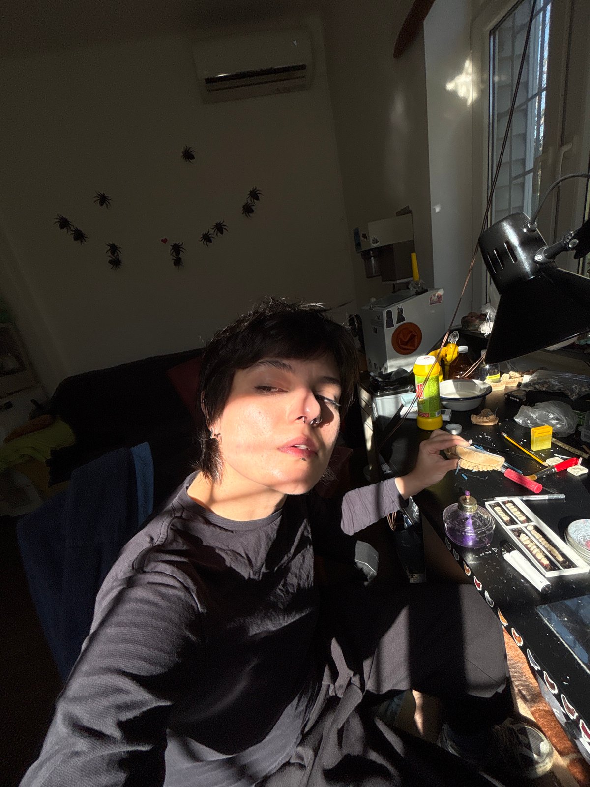 Dental technician works with casts and artificial teeth in Sofia lab