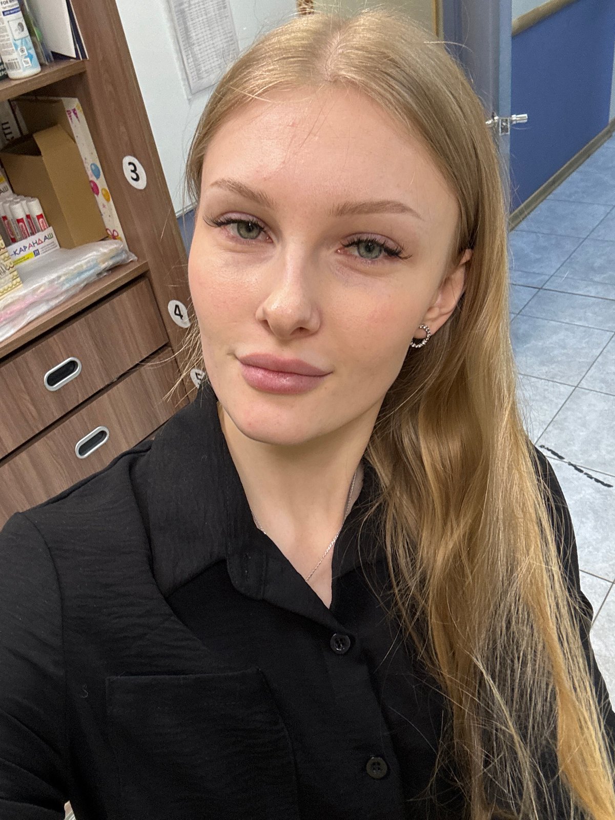 Woman takes selfies in Perm, Russia indoor location