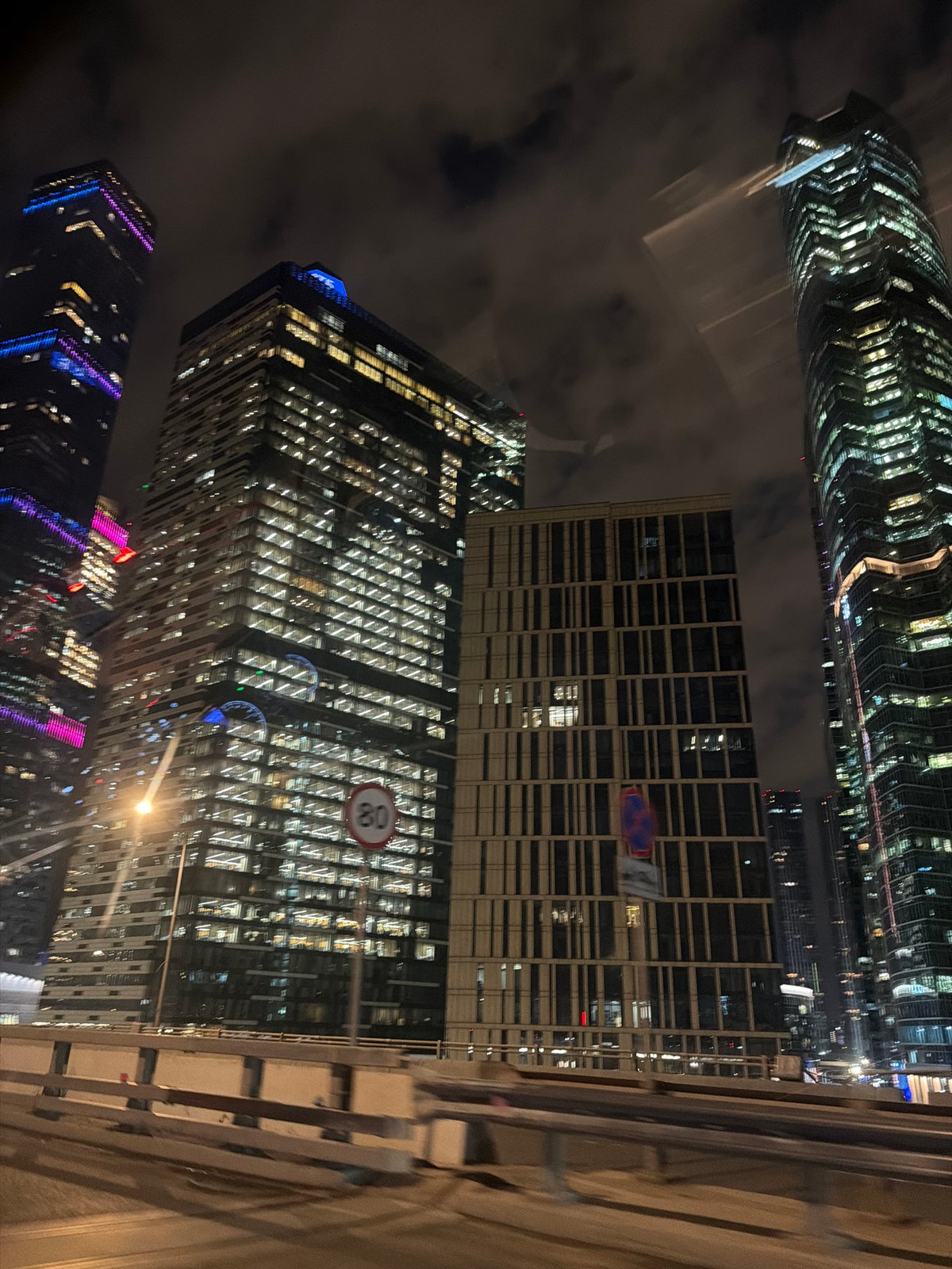 Moscow City skyscrapers illuminated during evening hours