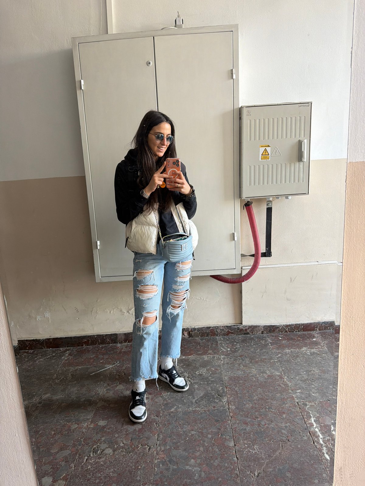 Woman takes selfie in decorated indoor space in Sofia
