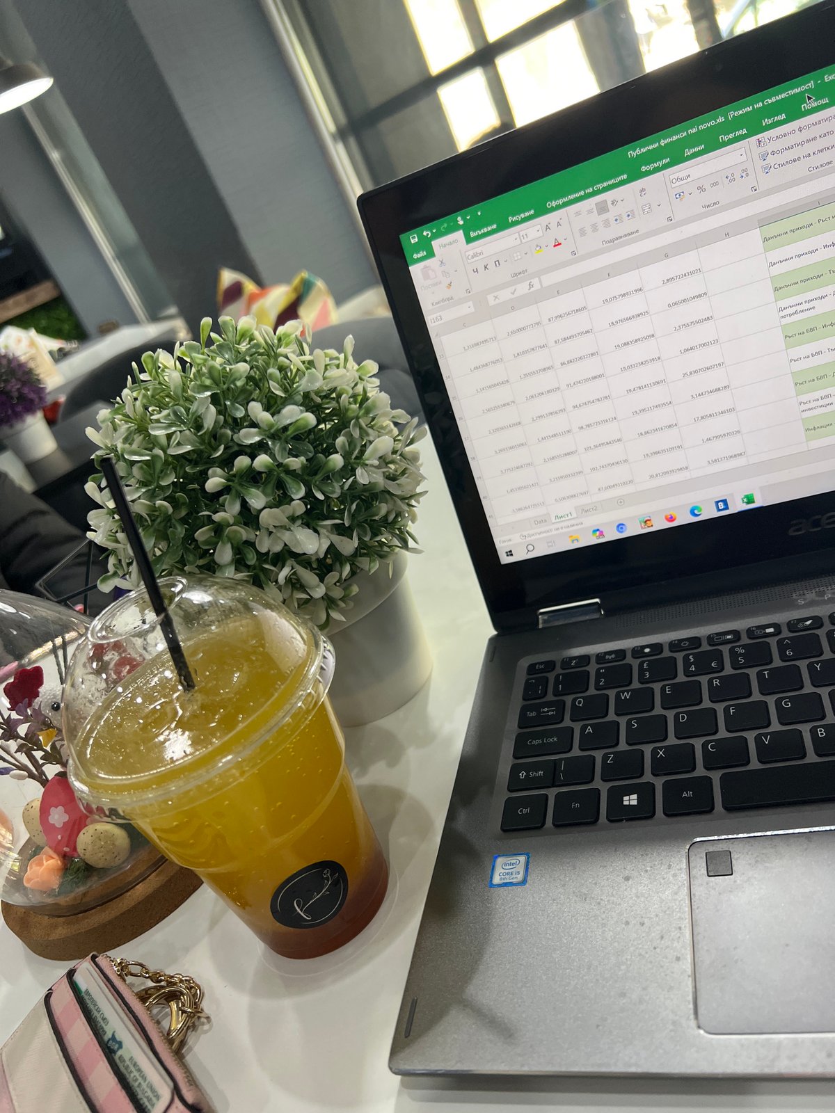 Laptop workspace documented in Plovdiv cafe during morning hours