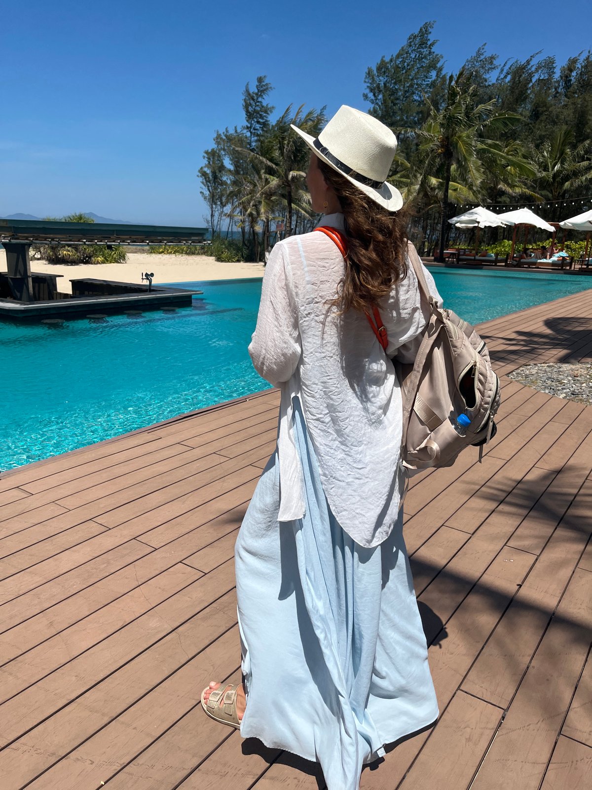 Woman photographs morning moments at Đà Nẵng tropical resort