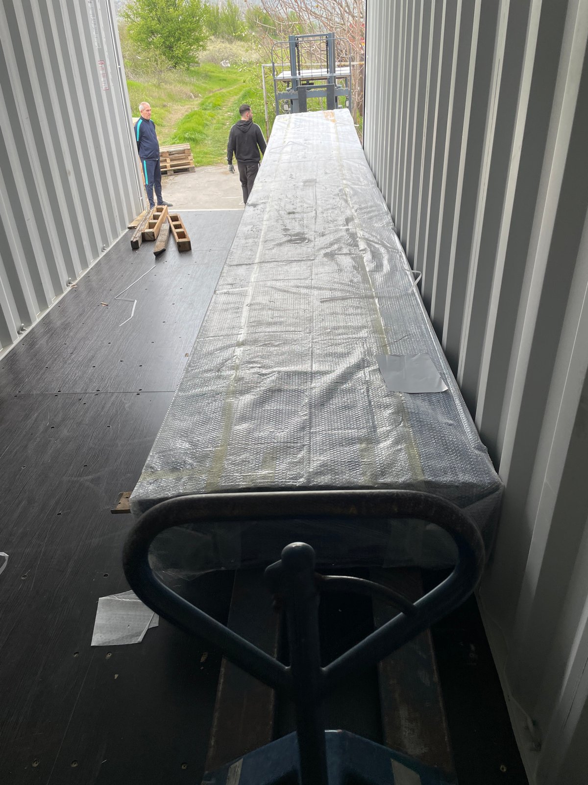 Shipping container loading operations documented in Asenovgrad, Bulgaria