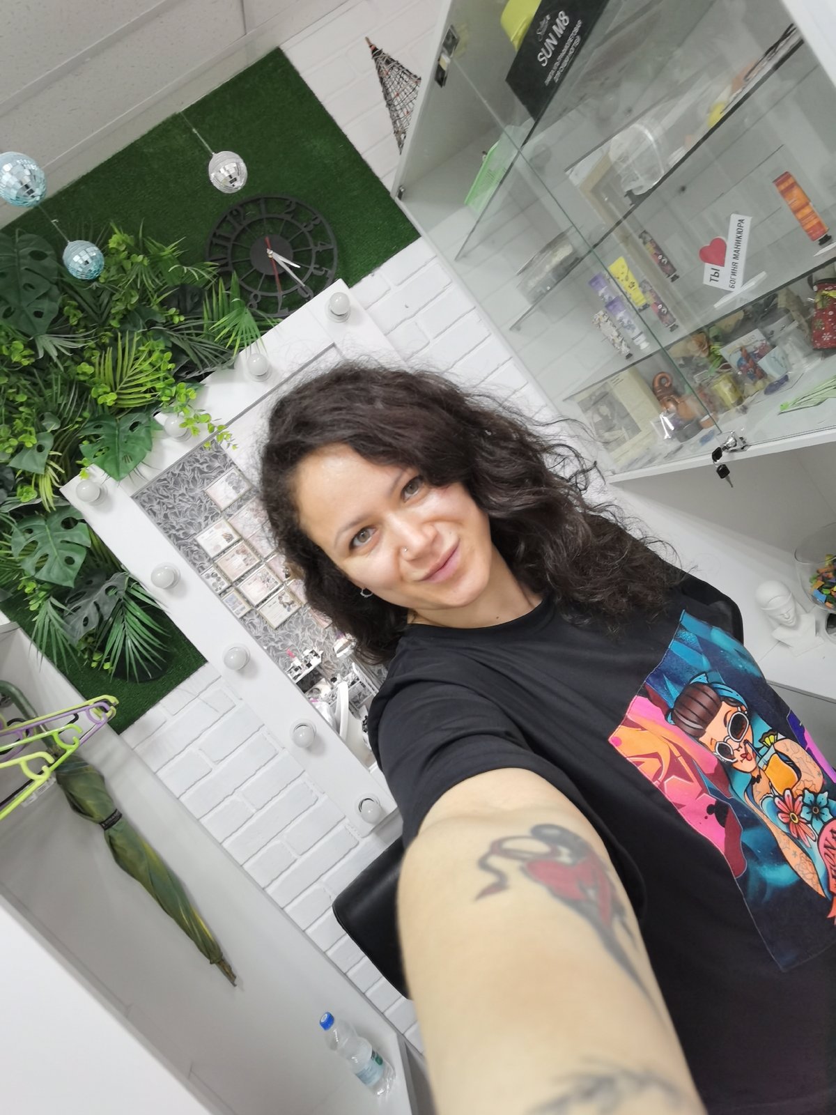 Woman documents afternoon with selfies and flowers in Chaikovsky