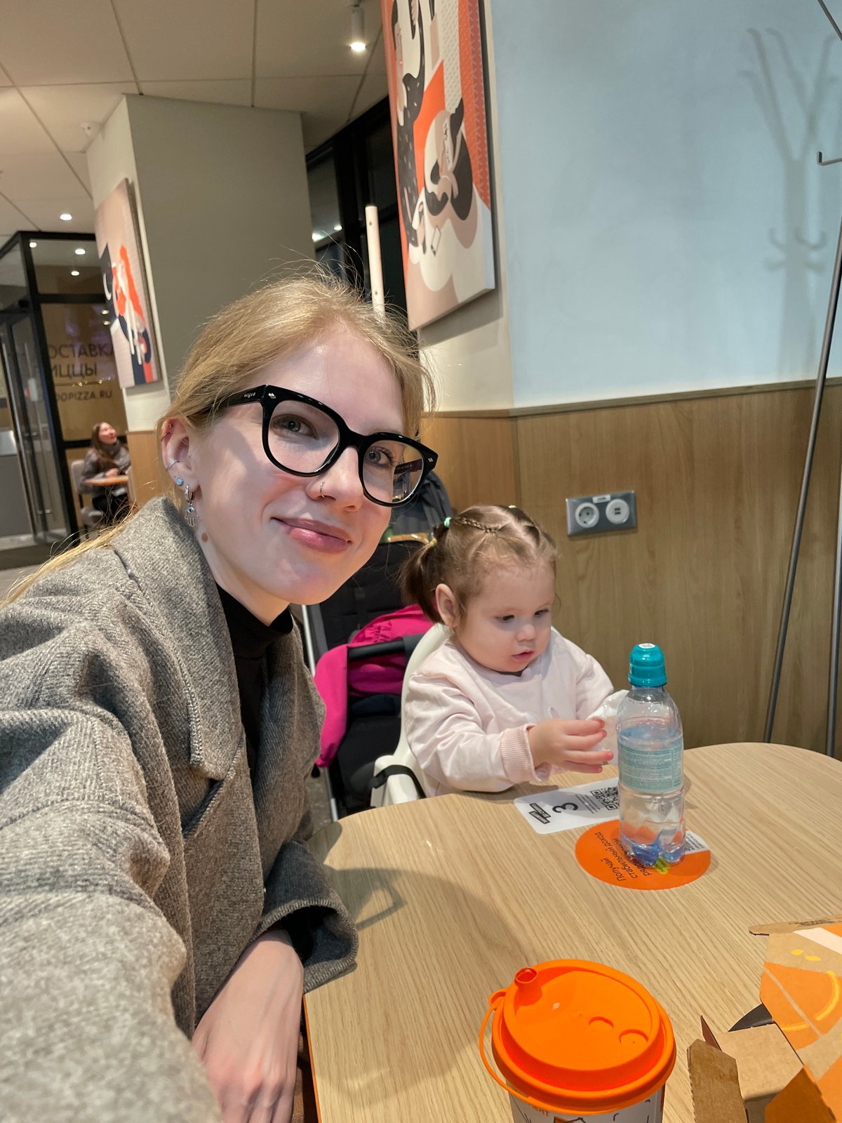 Mother and child share meal at Izhevsk restaurant