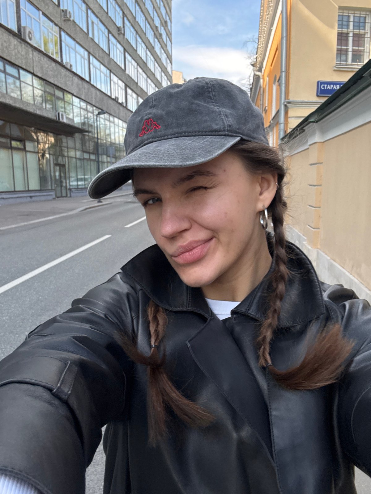 Moscow street scenes captured: selfie, historic architecture, vintage car