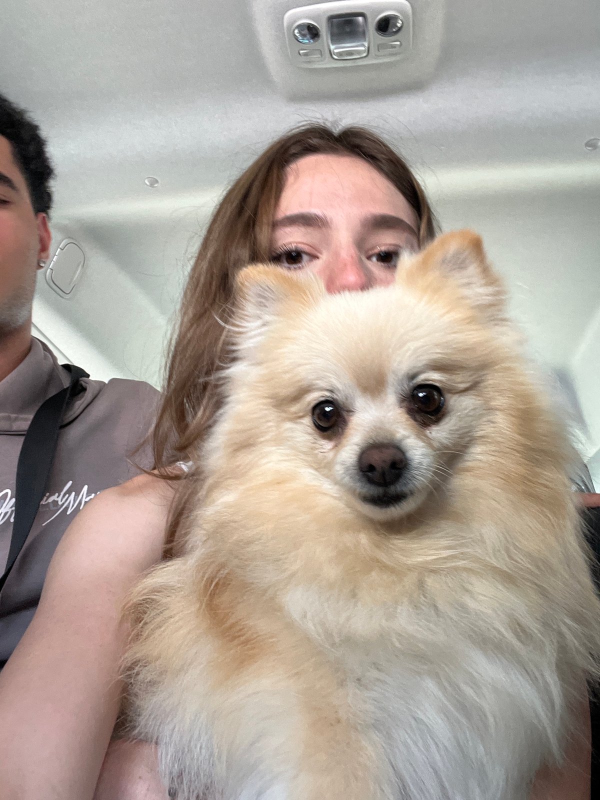 Woman poses with Pomeranian dog in Mexican town