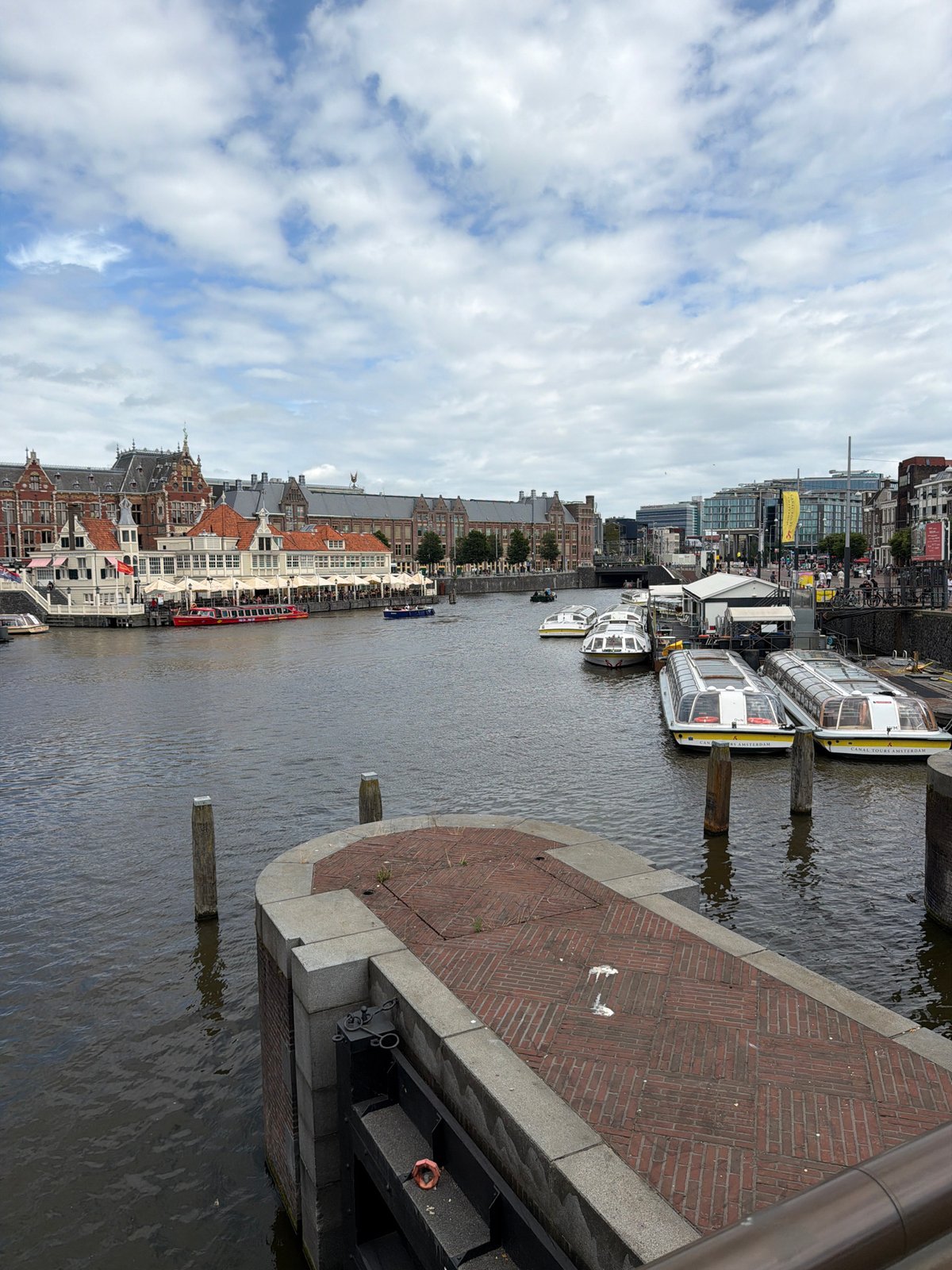 Amsterdam canals and streets on a busy summer afternoon