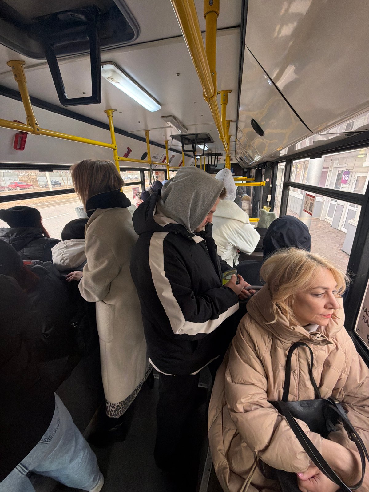 Ordinary moments captured in Krasnoyarsk: bus passengers, elevator selfie