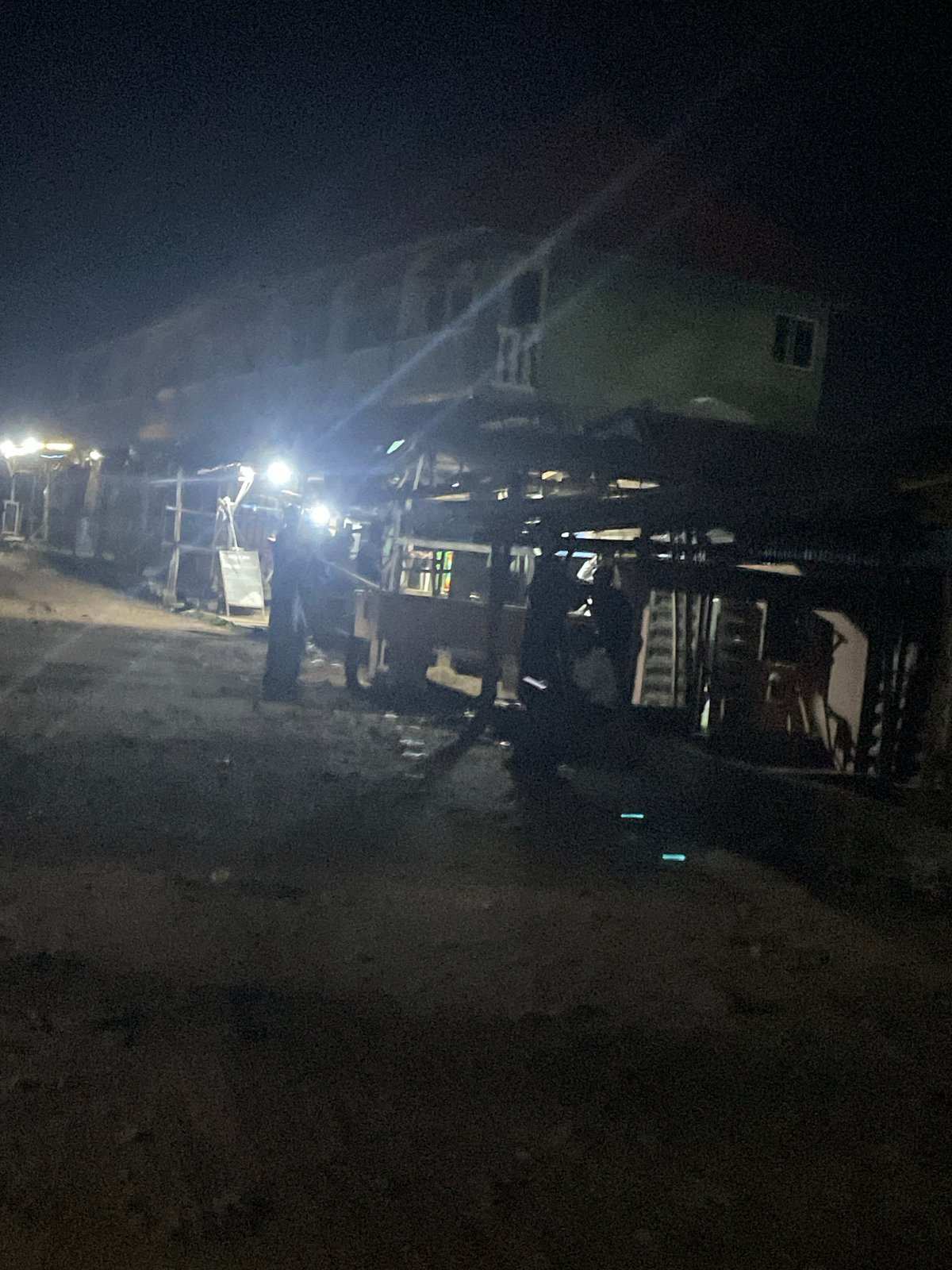 Lokoja street life after dark: markets, fuel stops, and road traffic