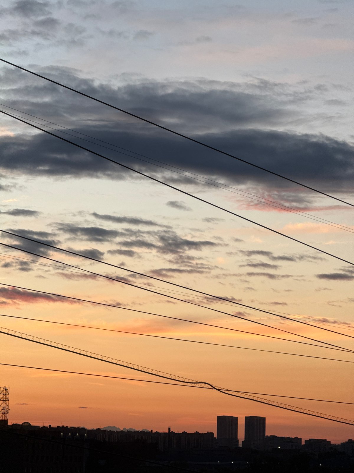 Moscow at dusk: power lines, sunset skyline, and street-level details