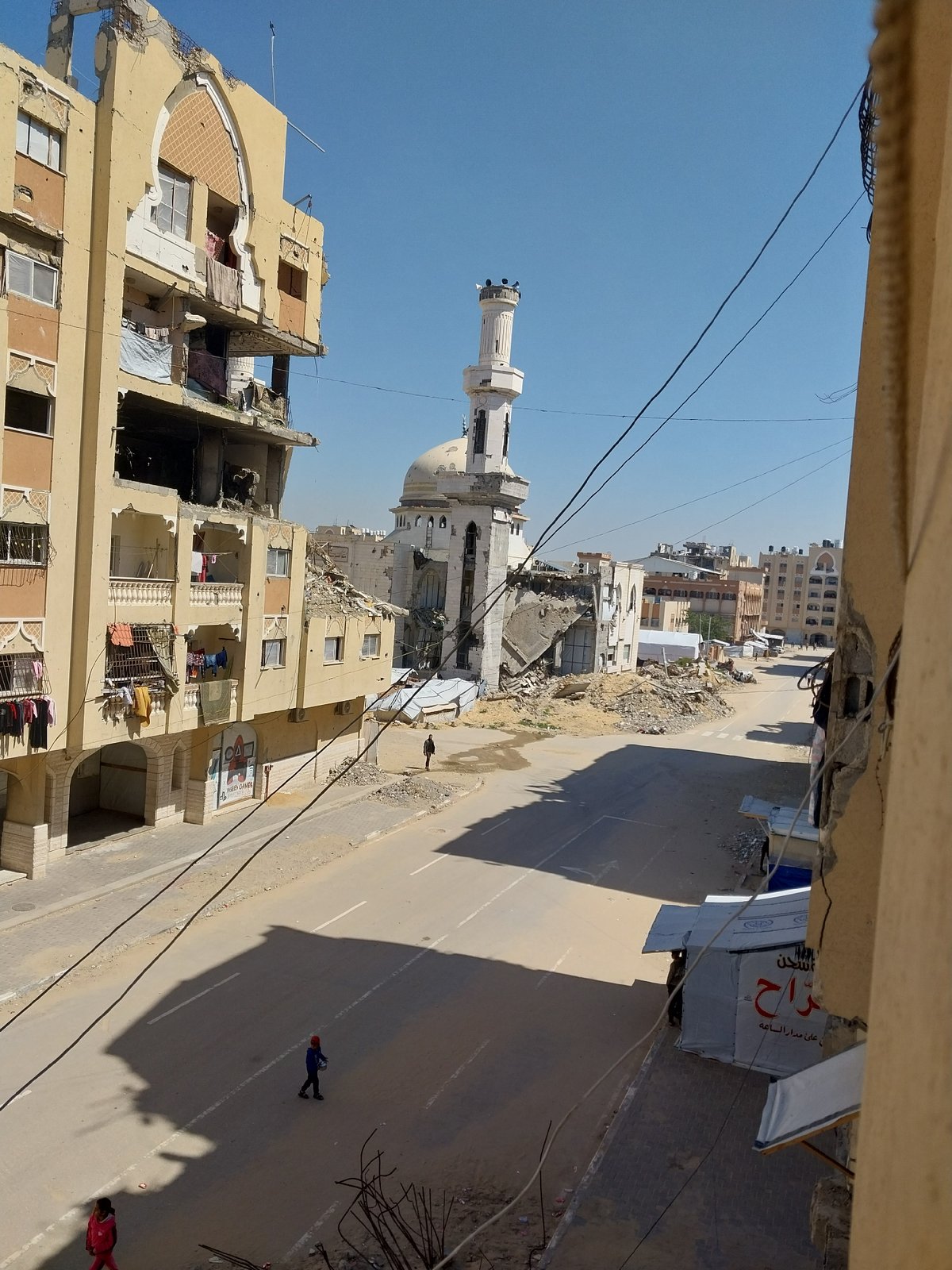 Aerial documentation shows urban refugee settlement conditions April 2026