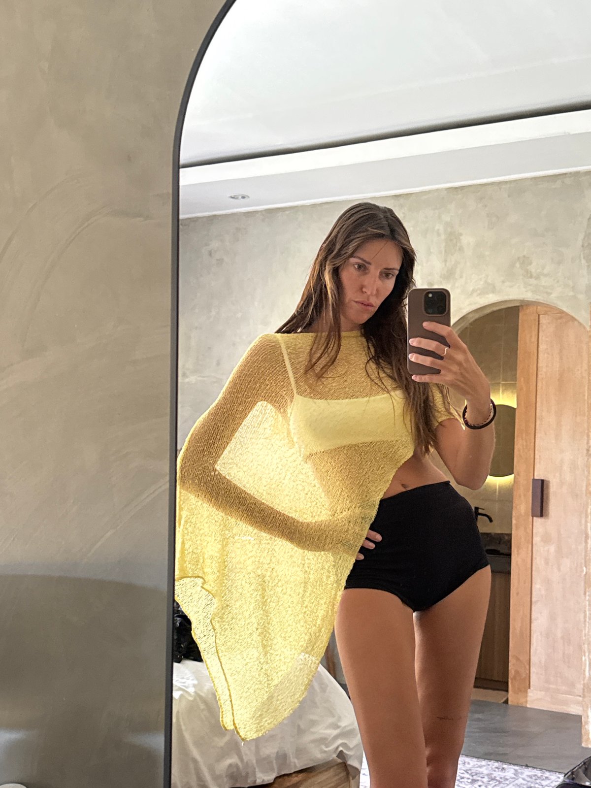 Hotel mirror selfie in a yellow beach look, North Kuta