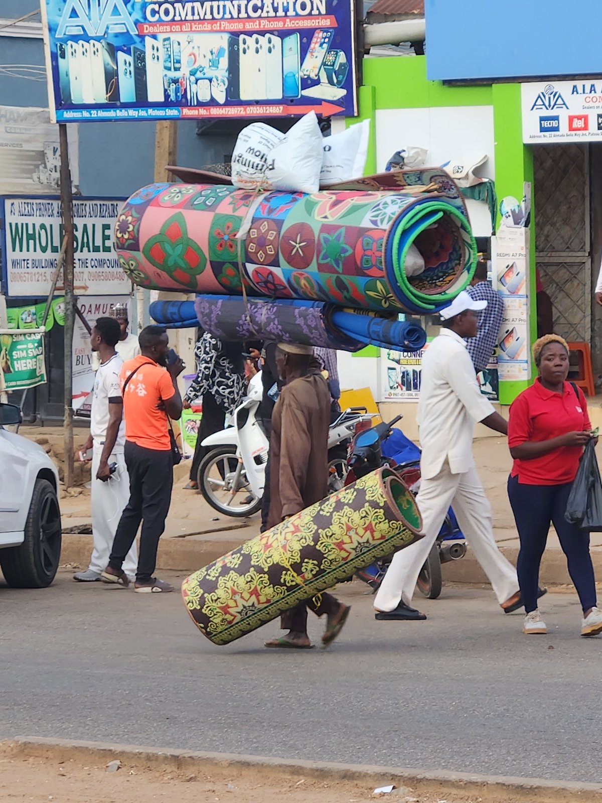 Daytime street life documented in Jos commercial district