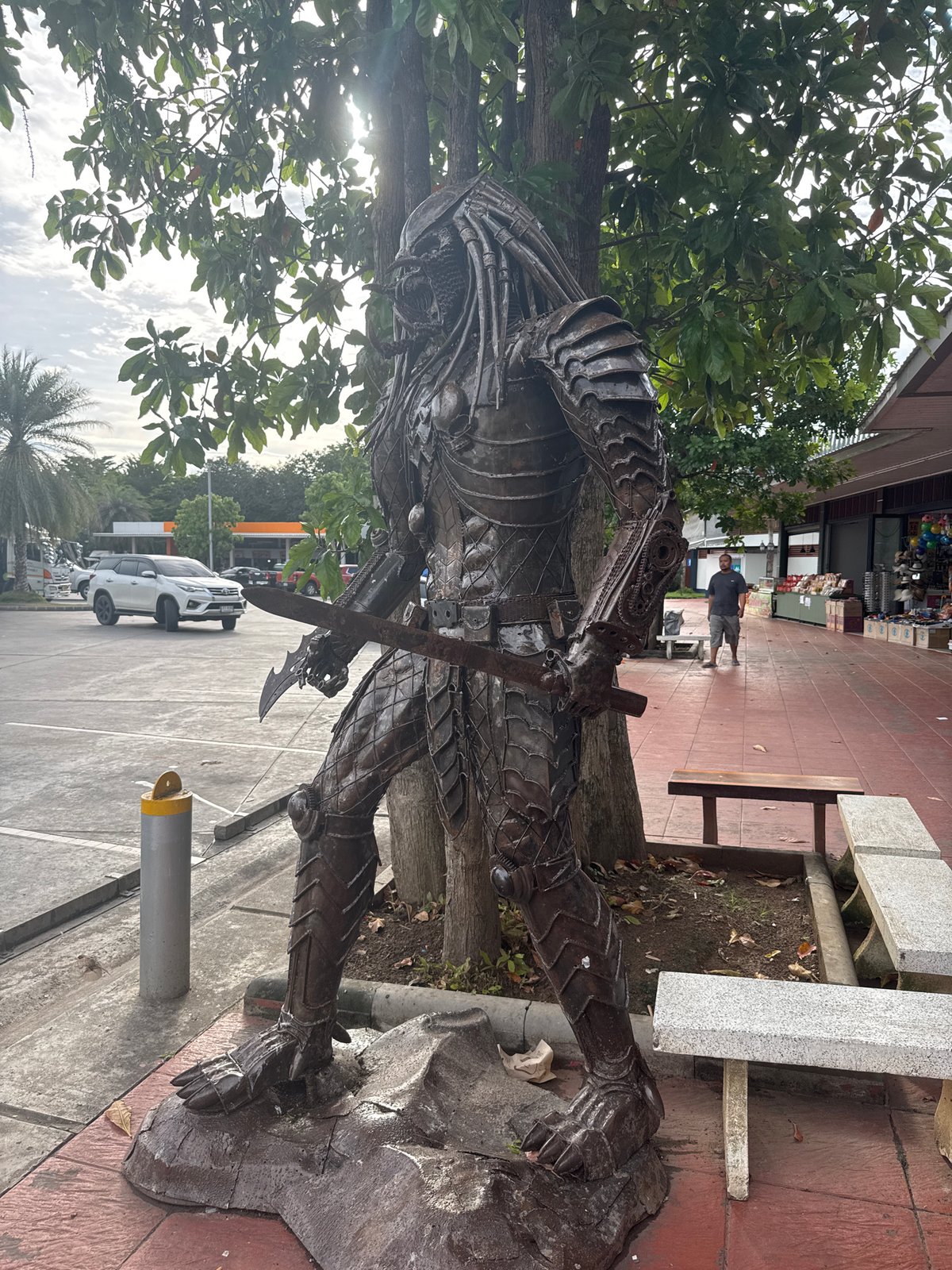 Scrap metal pop culture sculptures at a Thai roadside stop
