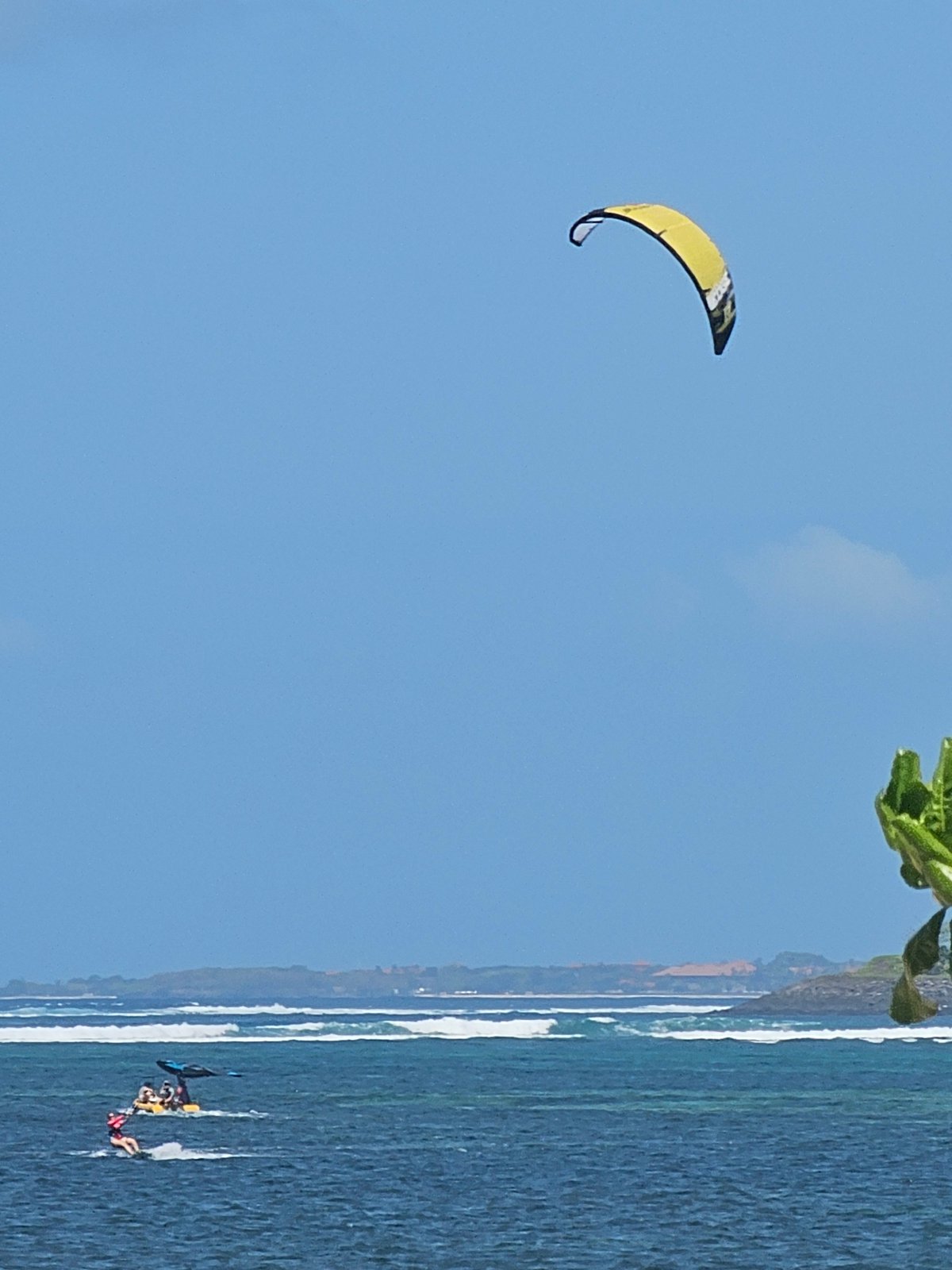 Kitesurfers hit the waves off Denpasar on a sunny morning