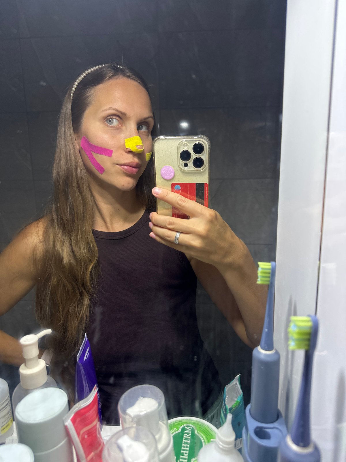 Facial taping and LED light therapy session in Fethiye bathroom