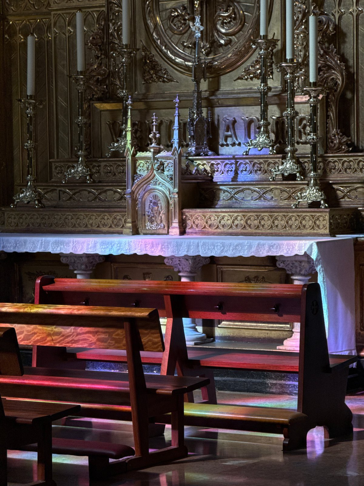 Church interior with ornate golden altar in San Sebastián