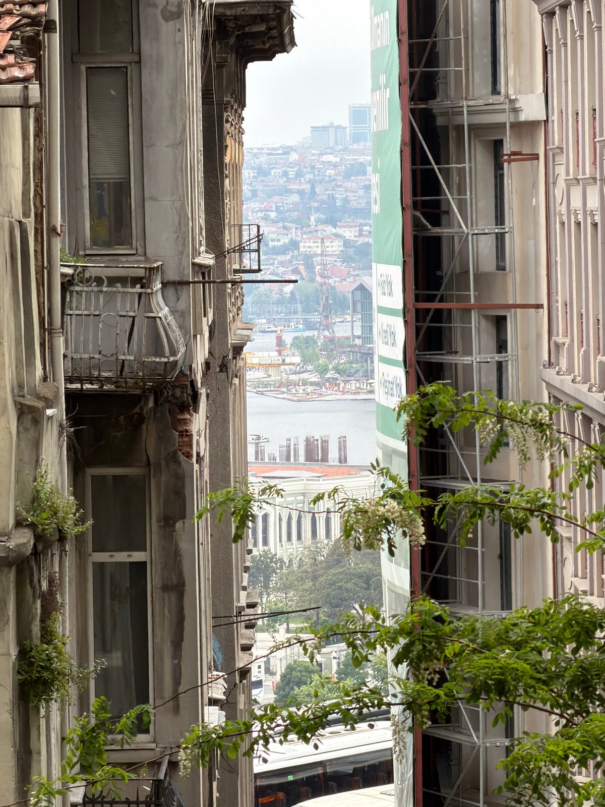 Six people gather at outdoor cafe in historic Beyoğlu district
