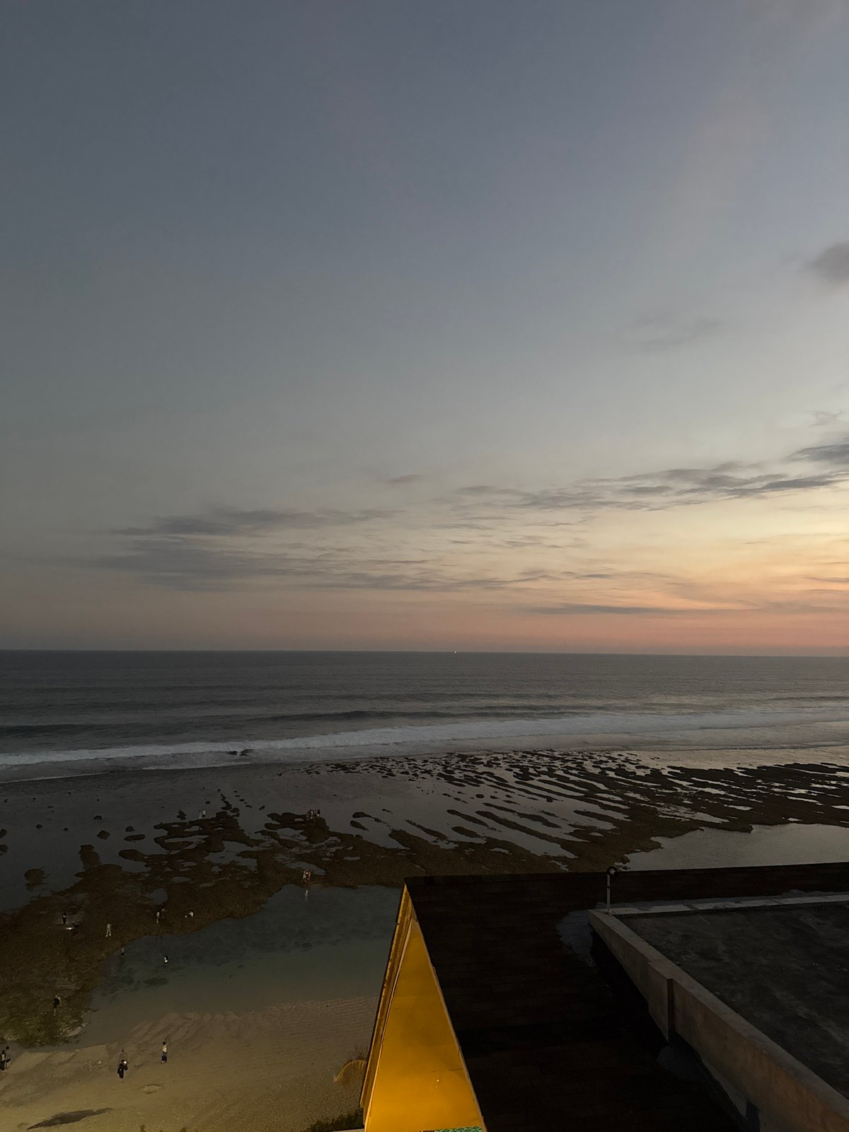 Dusk settles over a Kuta Selatan beach resort