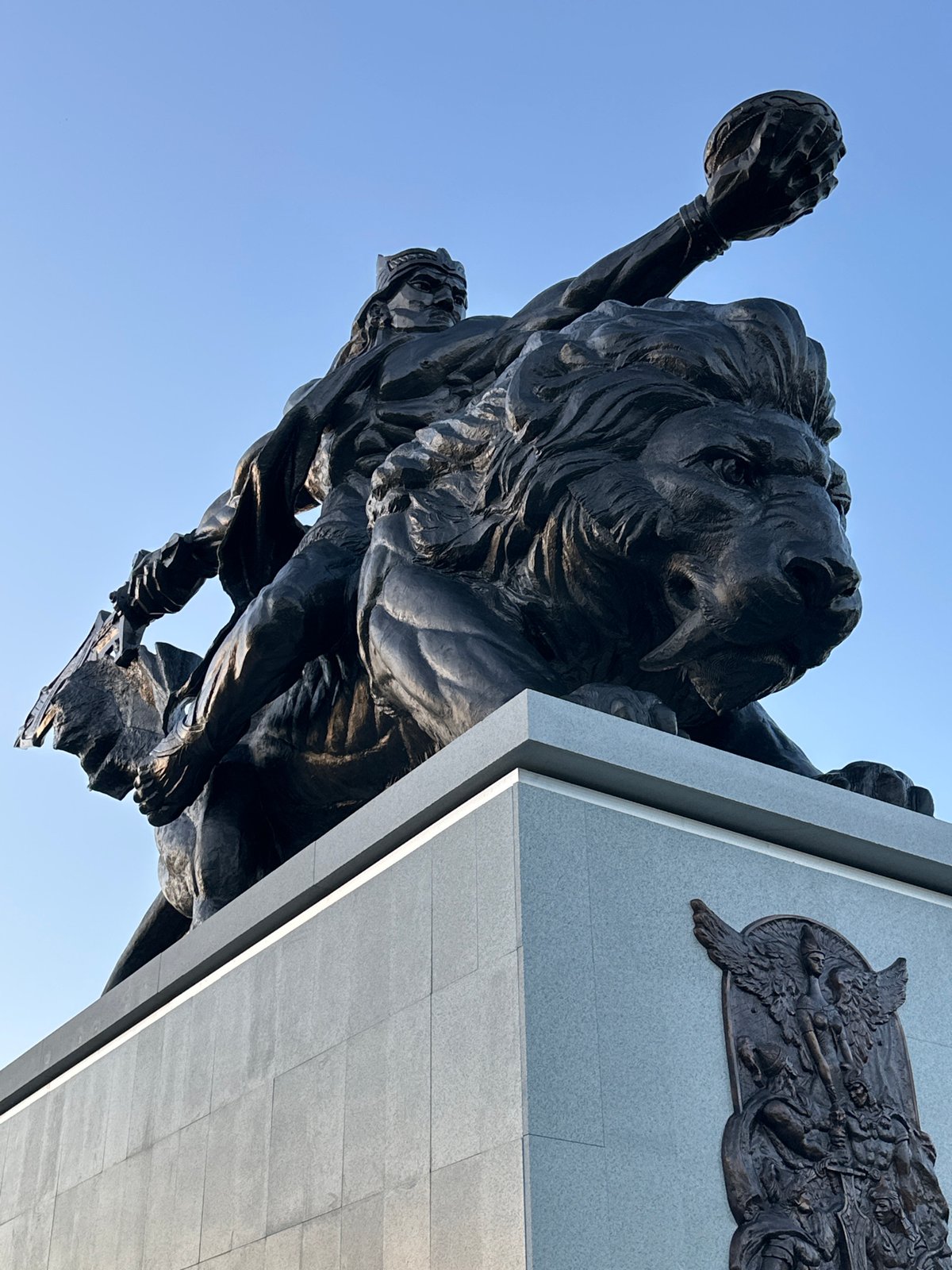 Observer documents statues, pinecones, and public art during afternoon walk