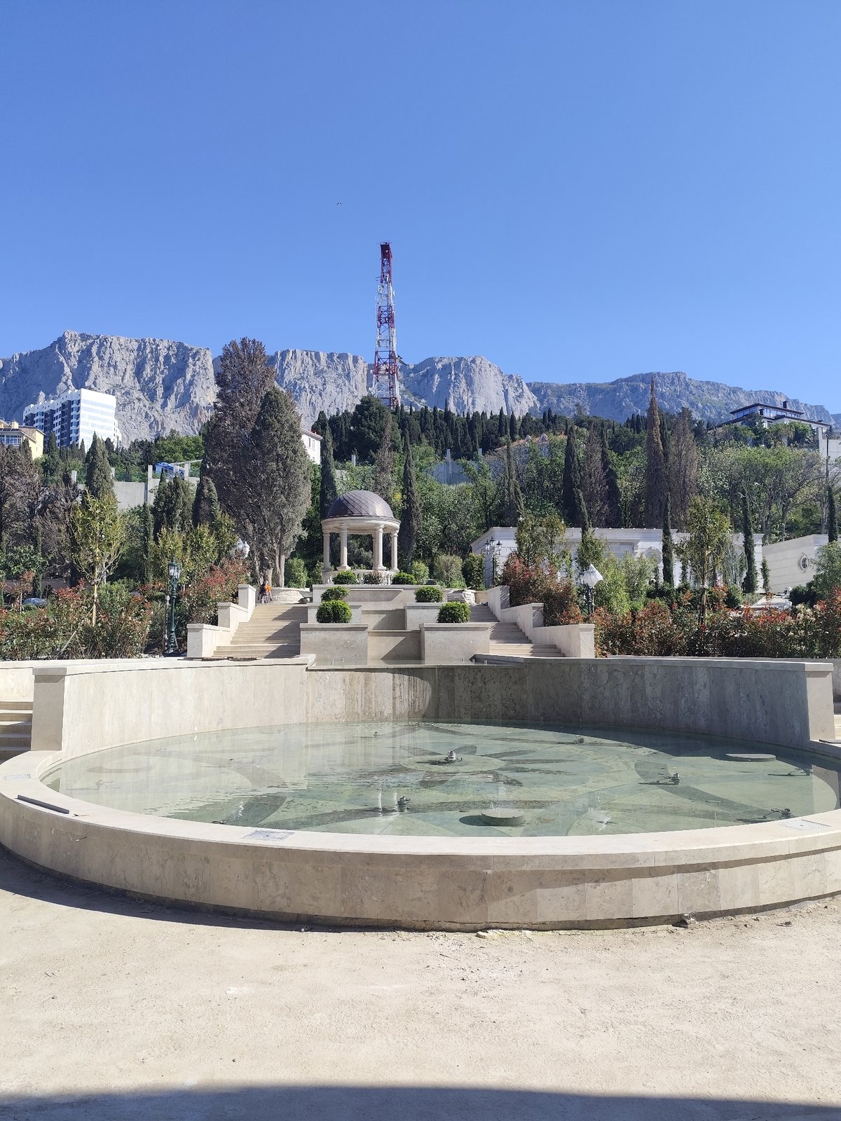 Empty stone fountain observed in Ukrainian park setting