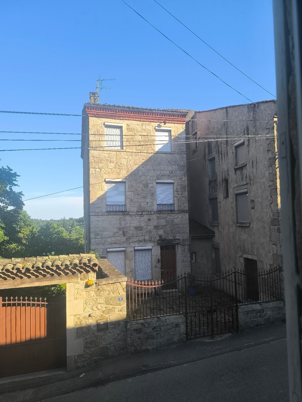 Street scene documented in Pélussin, France shows stone buildings