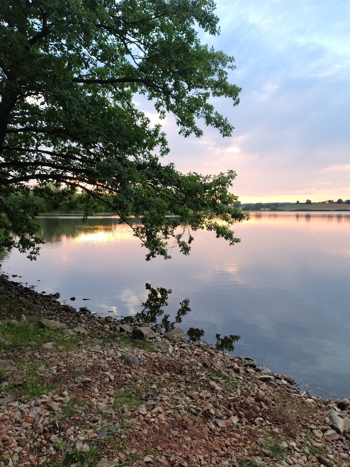 Dusk settles over a quiet lake in Kestřany, Czechia
