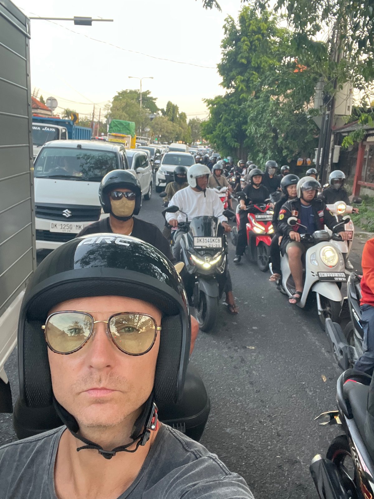 Motorbike ride through Denpasar traffic, temples, and street life