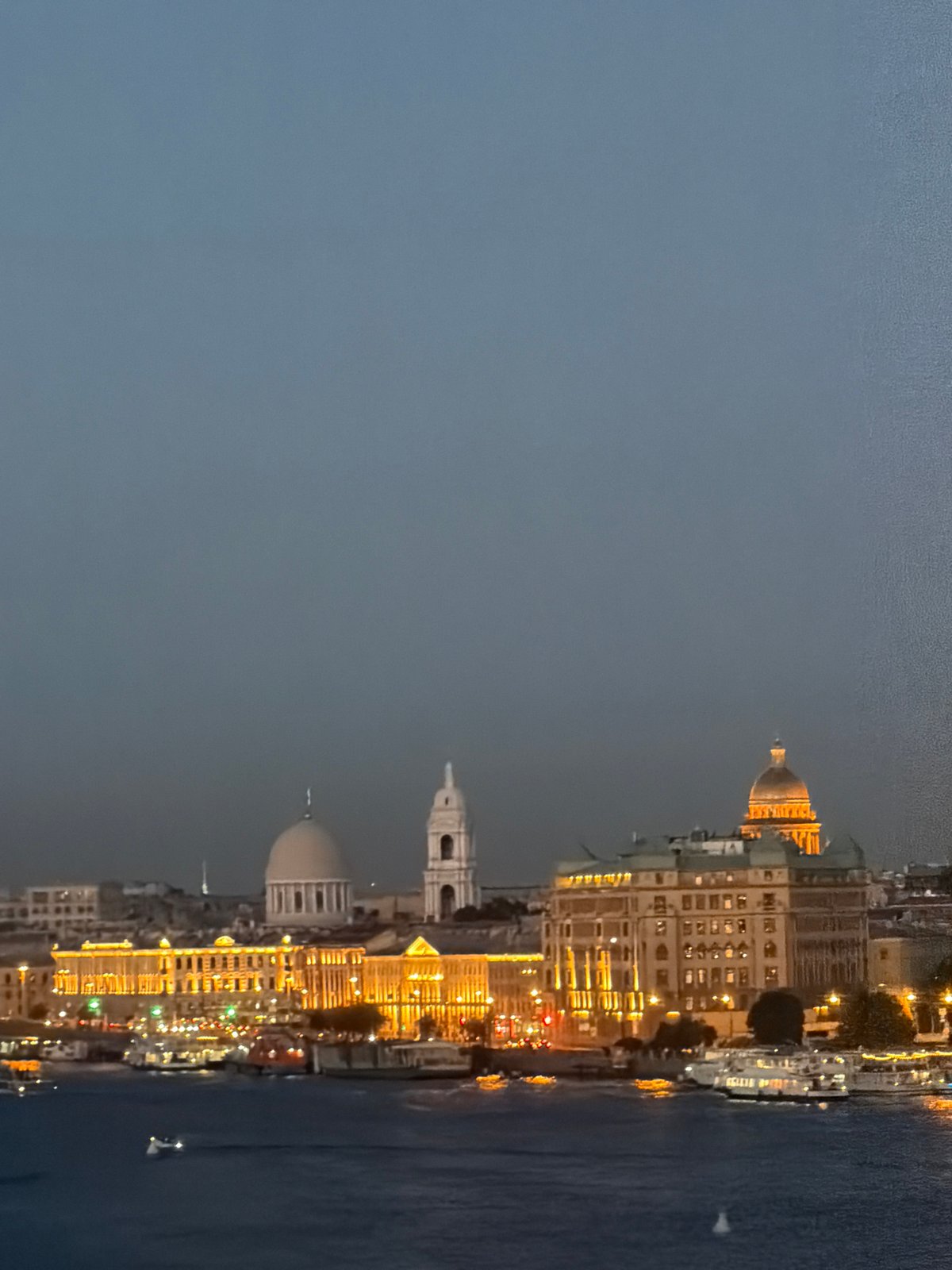 Passenger boat crosses the Neva at dusk, Saint Petersburg