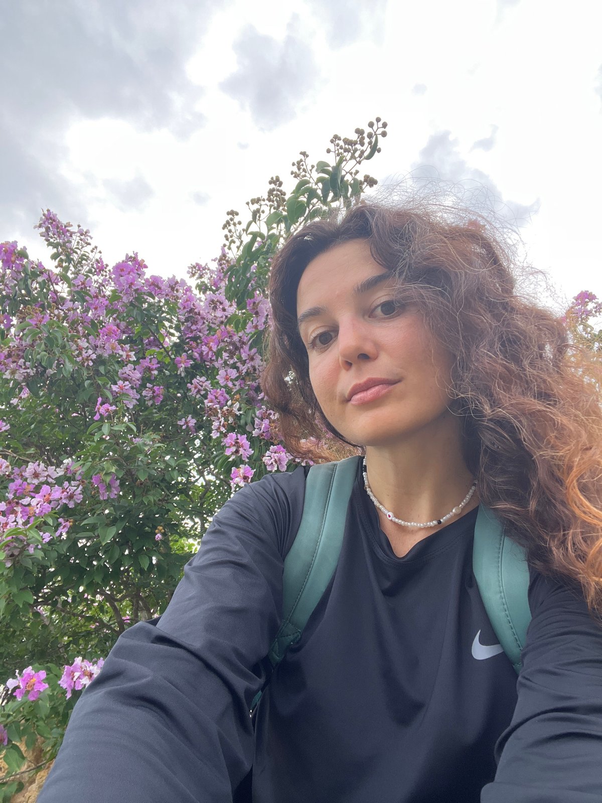 Roadside selfie stop among flowering plants in Phu Thuy Ward