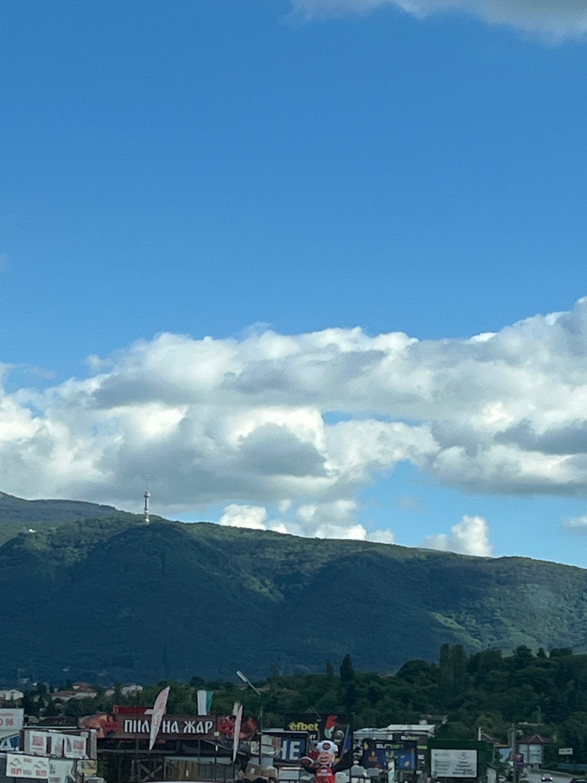 Highway drive through mountainous landscape with dramatic skies