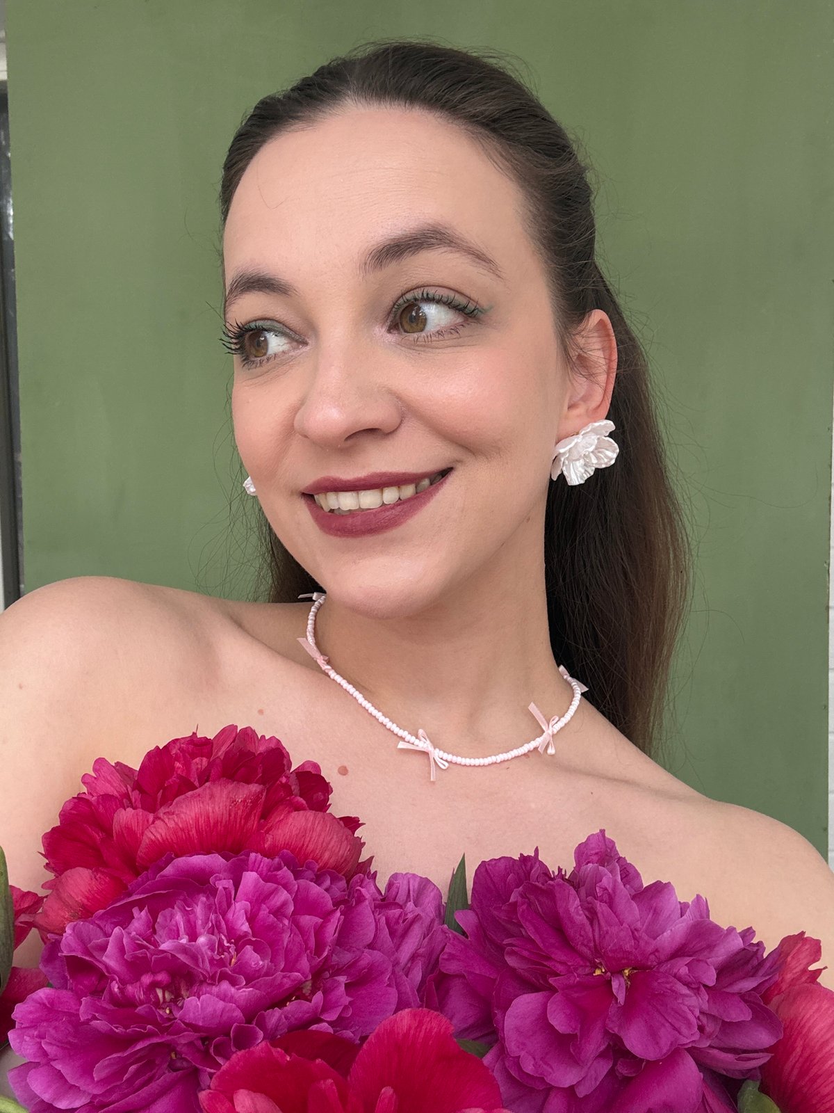 Woman poses with pink peonies in Chaikovsky photo session