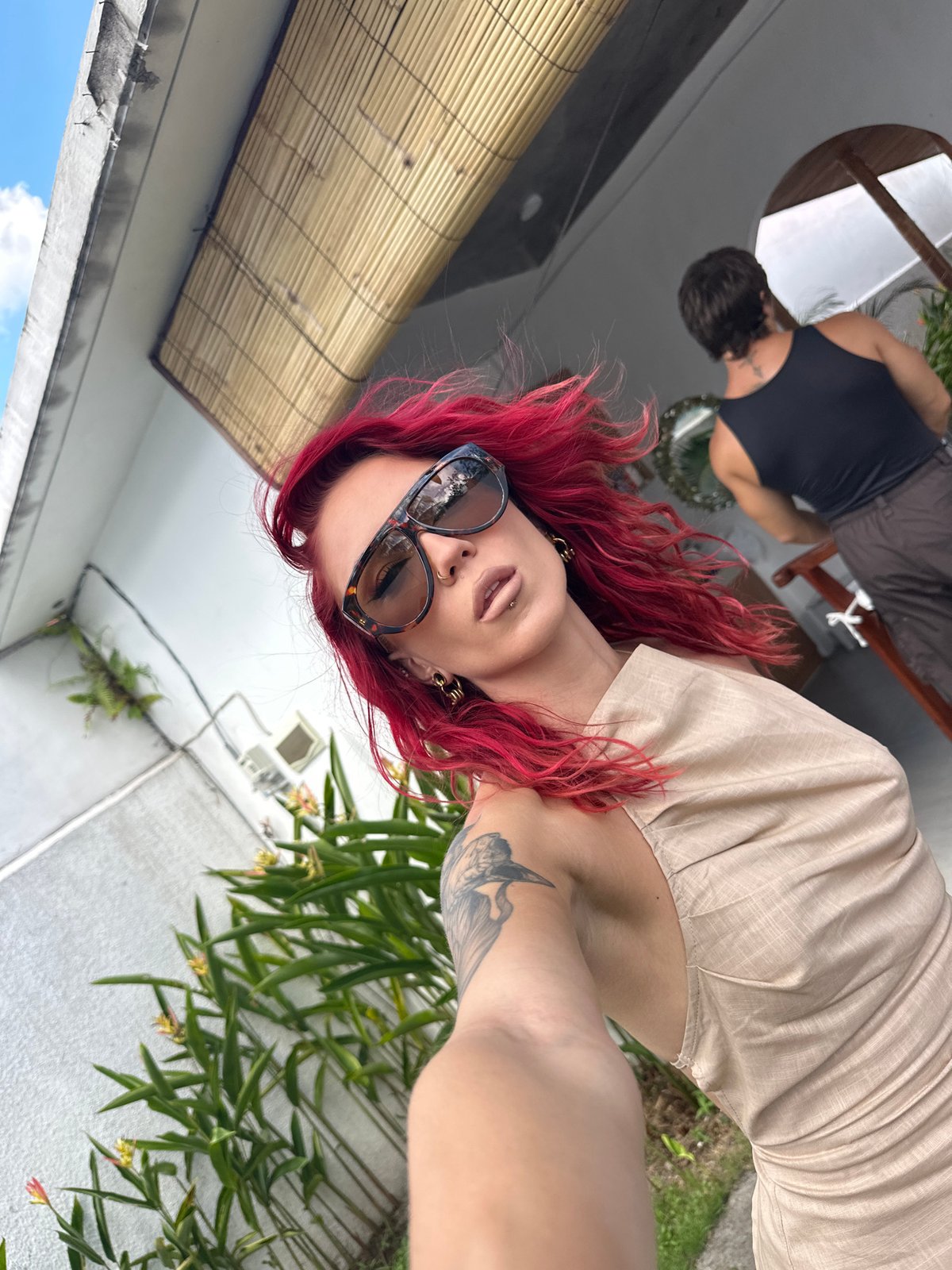 Red-haired woman photographed in multiple poses in North Kuta