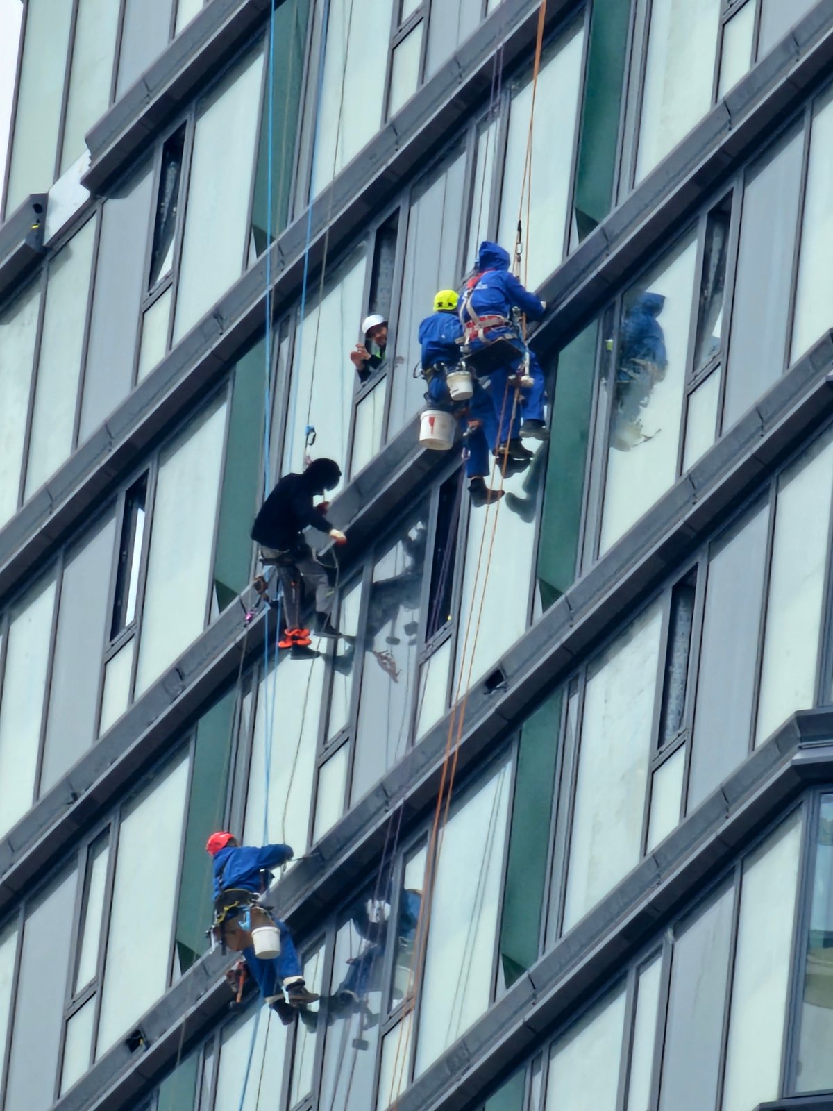 Window washers clean Moscow high-rise building exterior