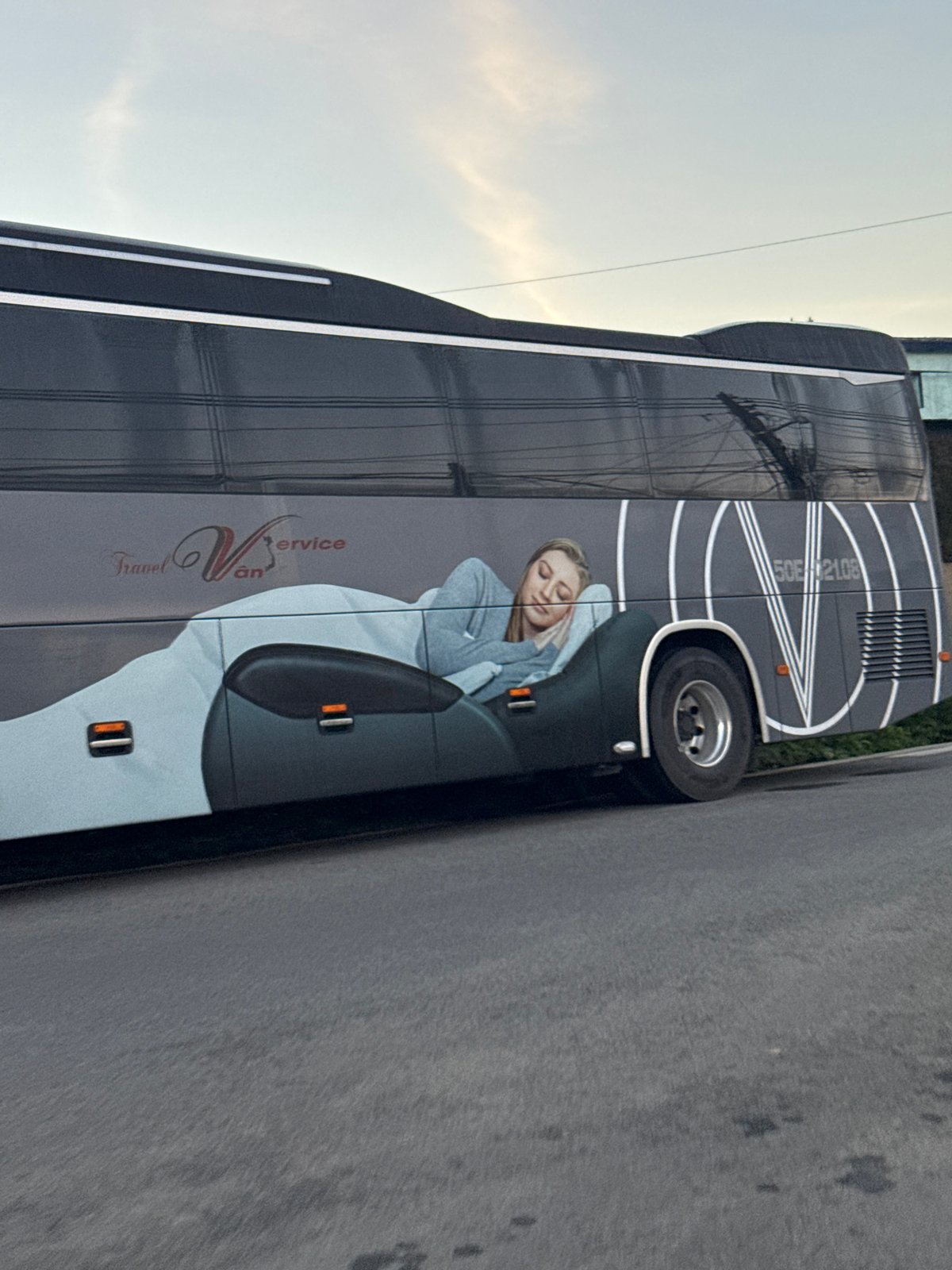 Evening scenes in Đà Lạt: a bus ad and a tea ceremony setup