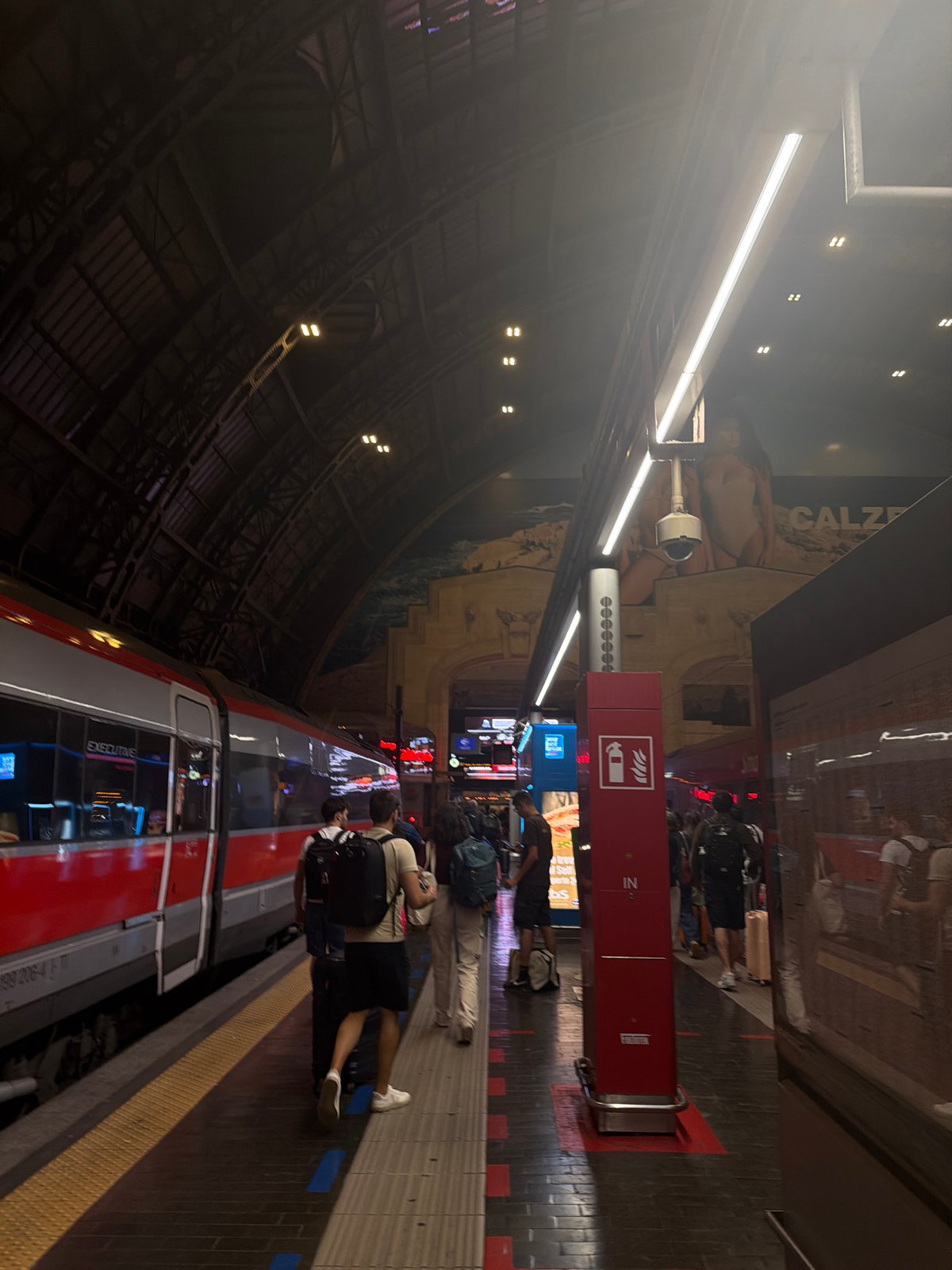 Evening scenes captured at Milan Centrale station, June 2026