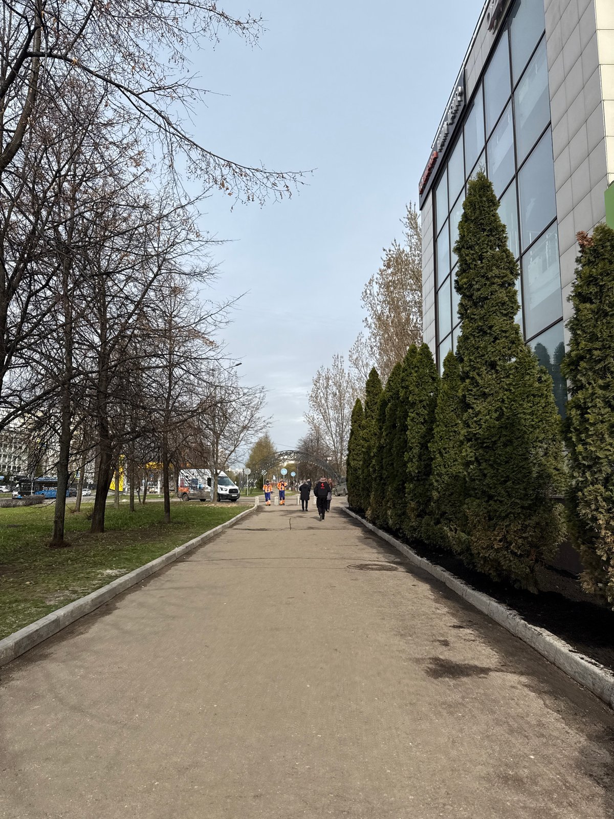 Woman photographed on Moscow sidewalk during morning walk
