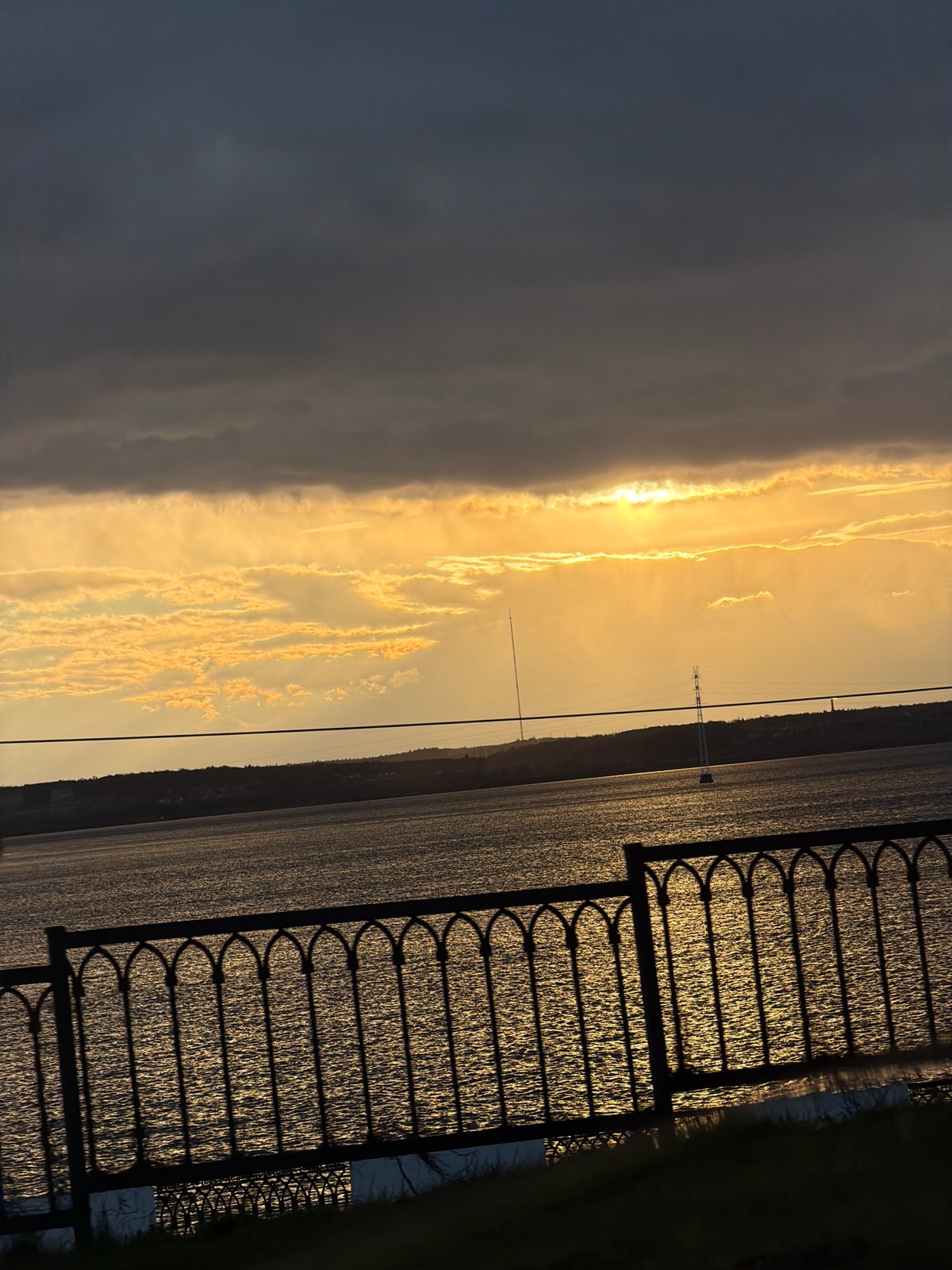 Golden sunset captured over water body in Izhevsk, Russia