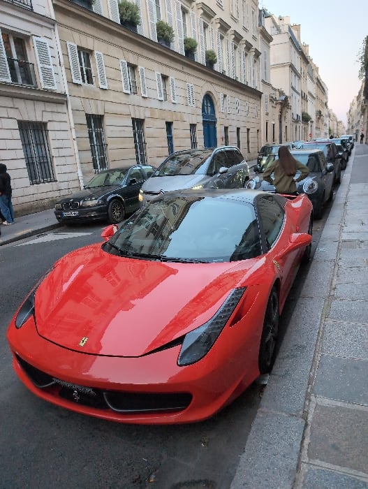 Red Ferrari spotted parked on Paris street