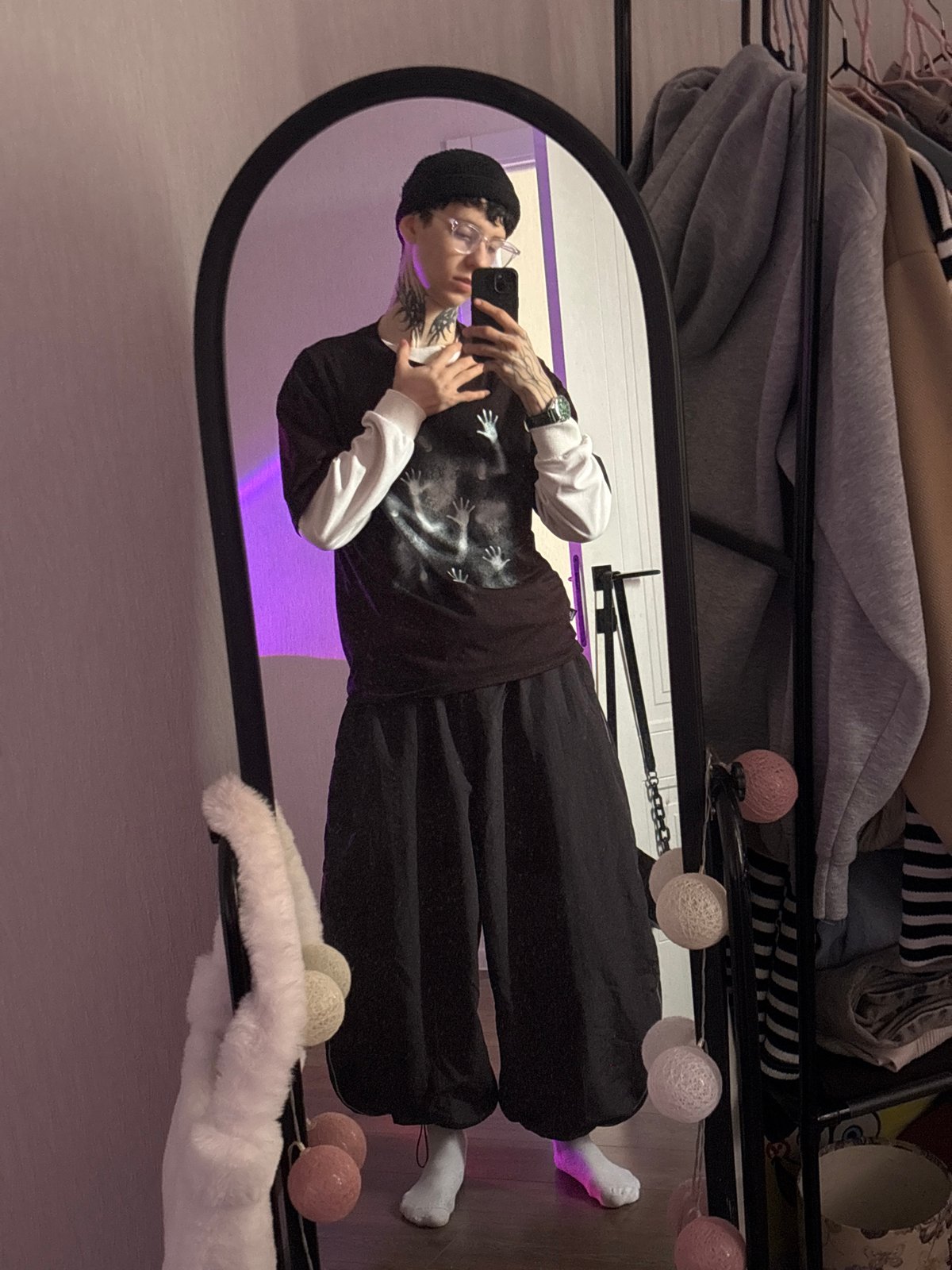 Person takes mirror selfies in Saratov clothing store