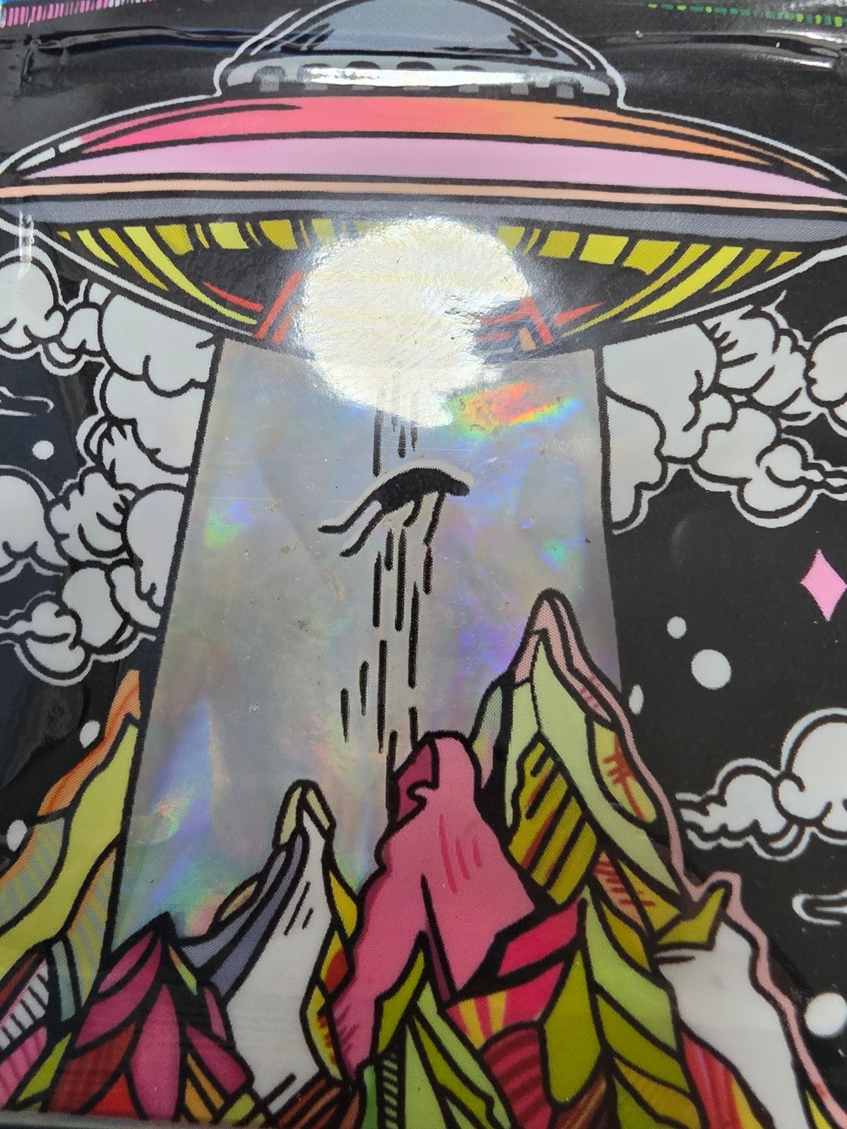 Witness Reports Colorful UFO Scene with Bright Beam