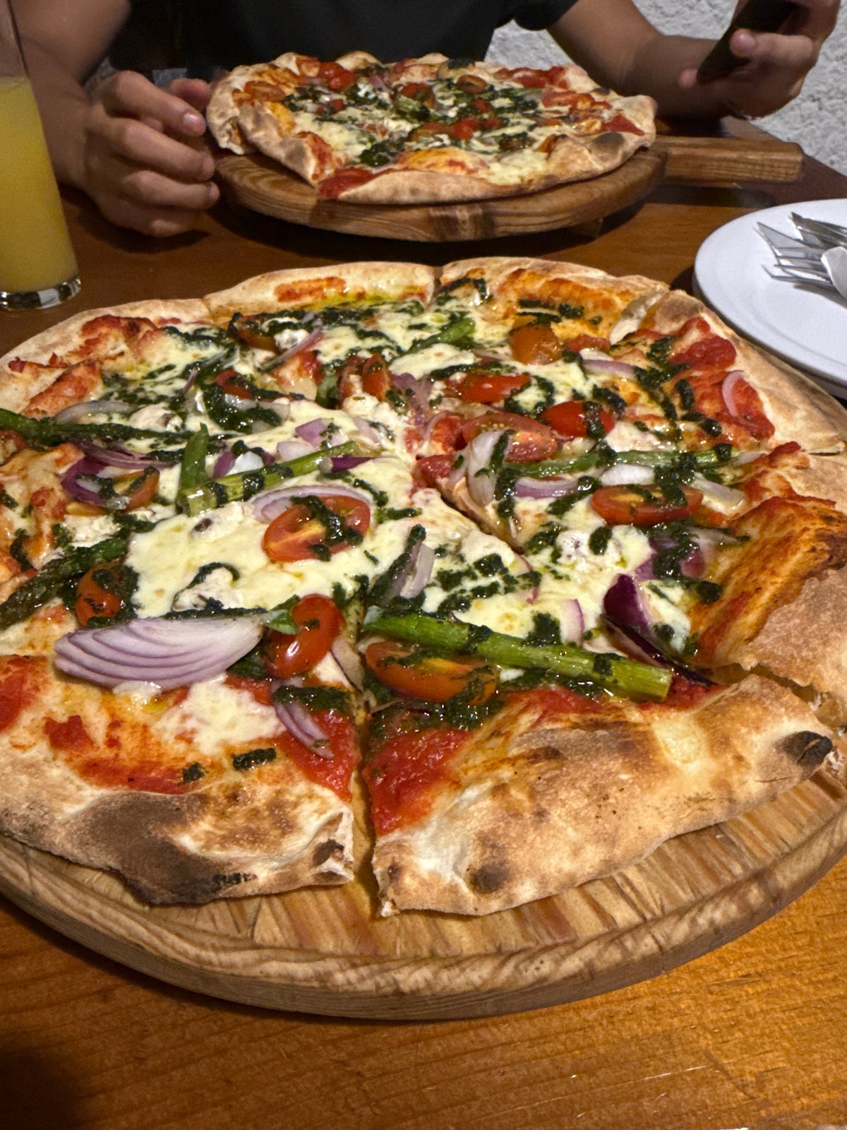 Late-night pizza dining captured at Chipilo restaurant