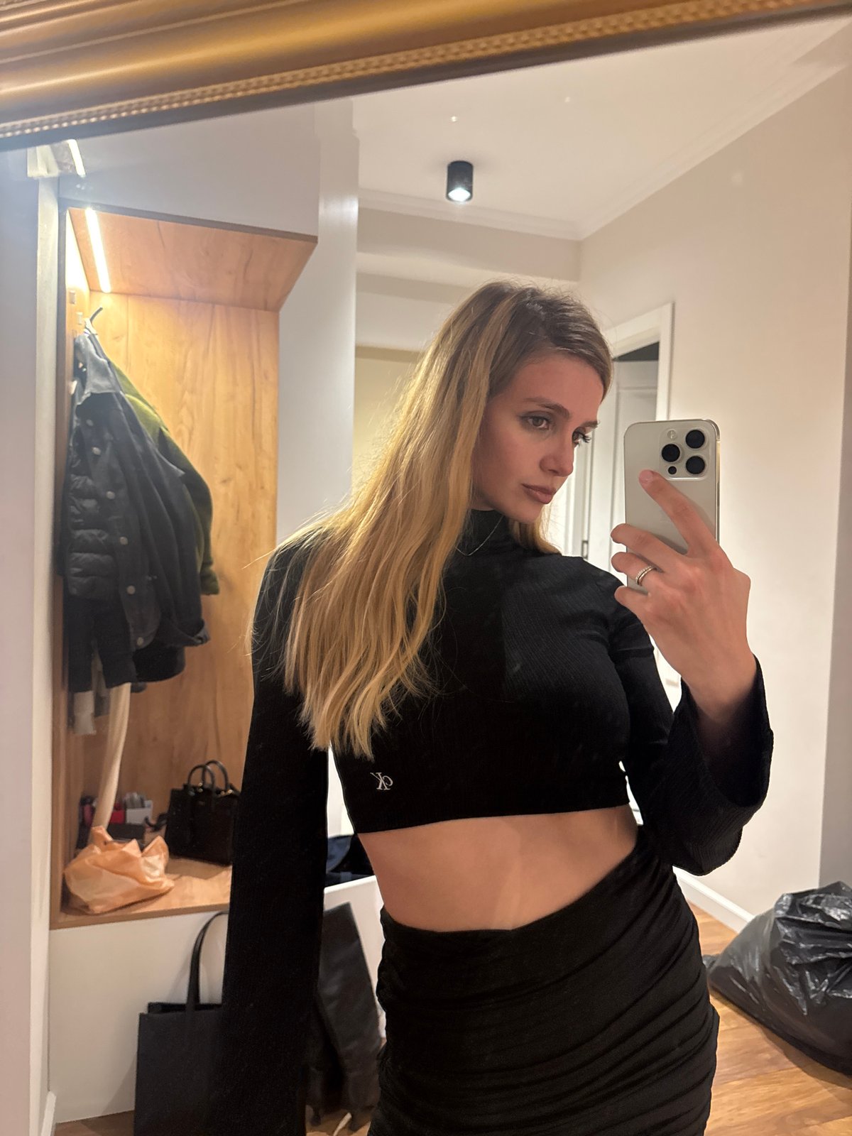Woman Takes Mirror Selfie with iPhone