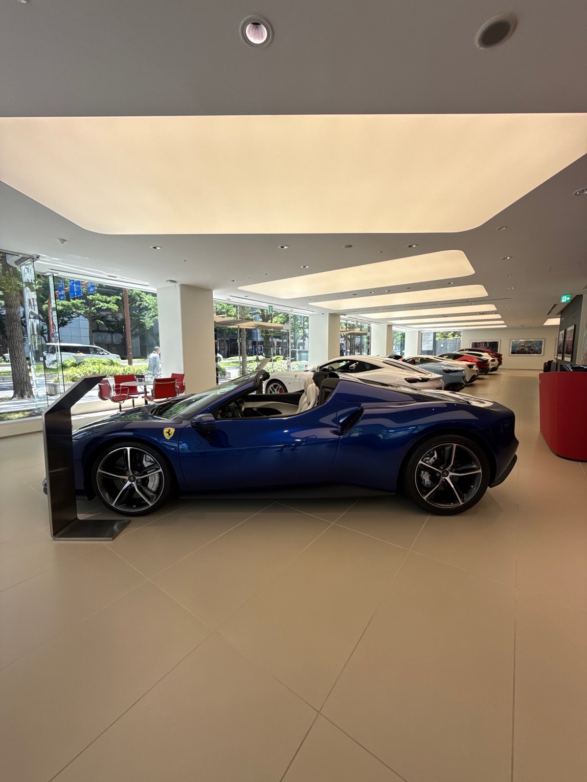 Ferrari dealership showcases luxury sports cars in Osaka showroom